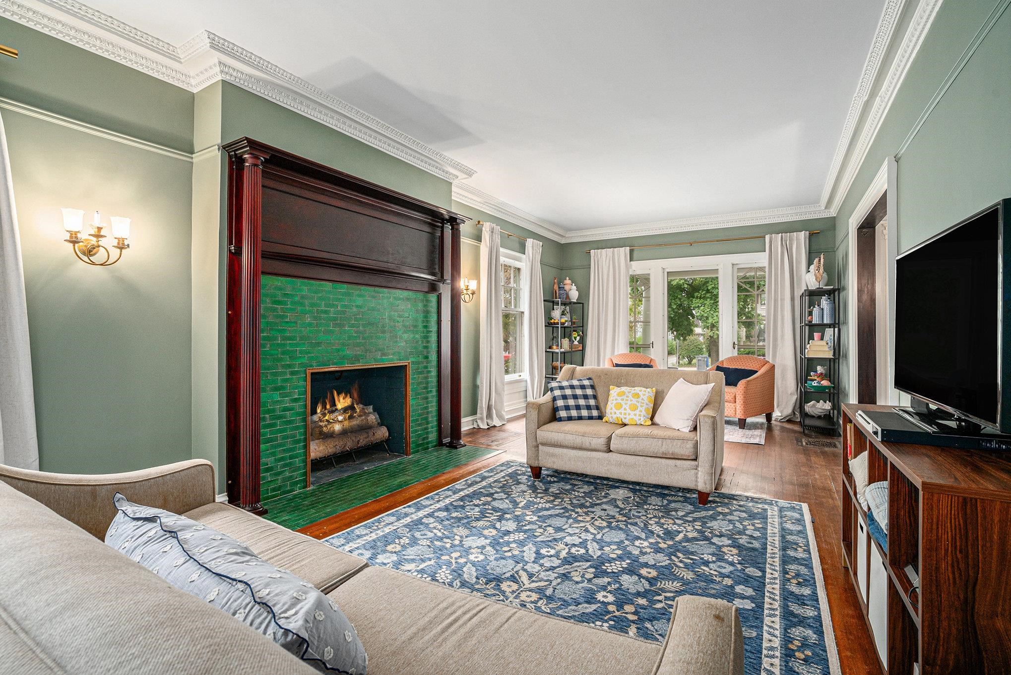 Restored fireplace, woodwork, and crown moldings. White oak refinished hardwood floors
