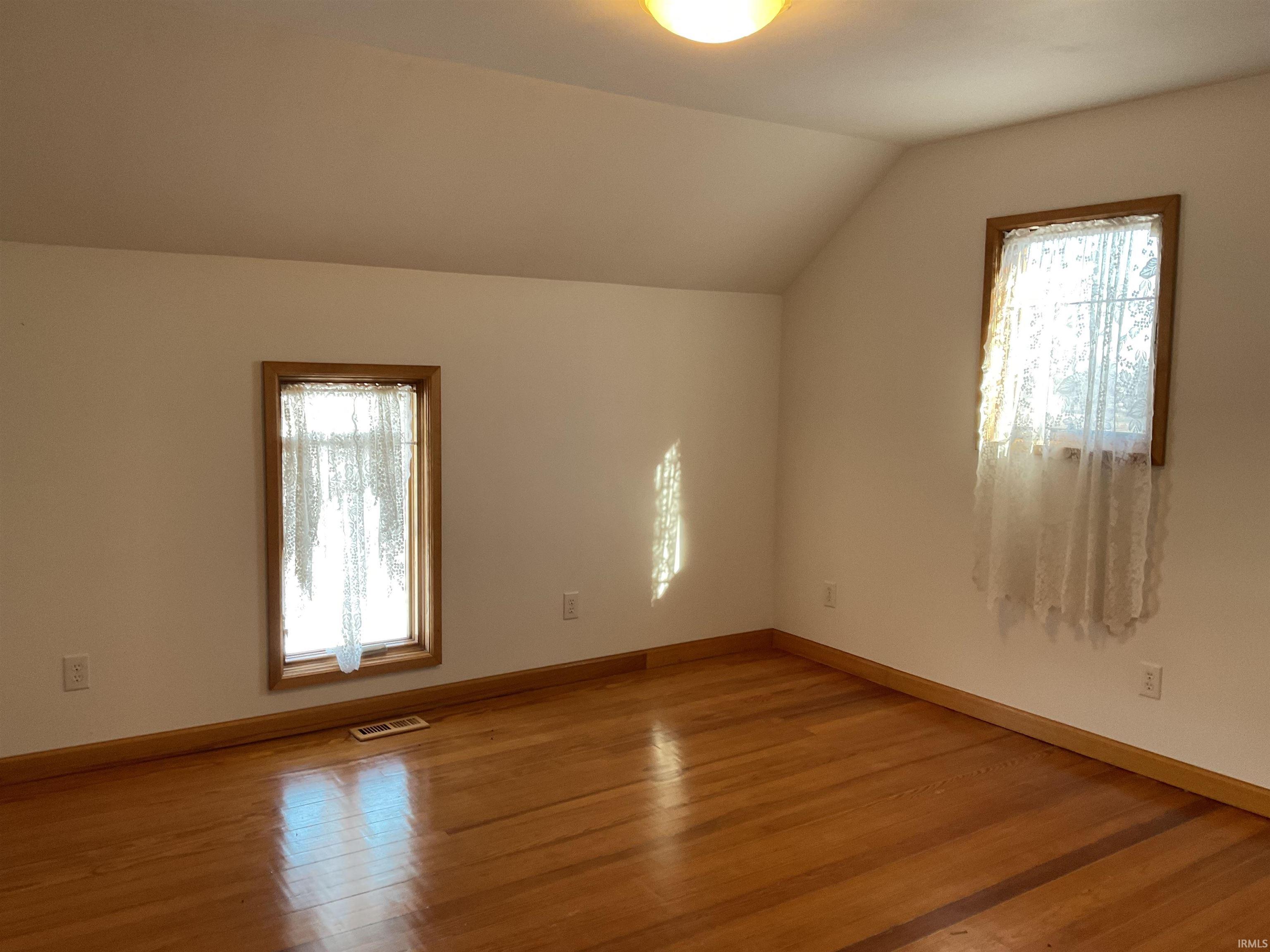 Second floor bedroom with wood floors