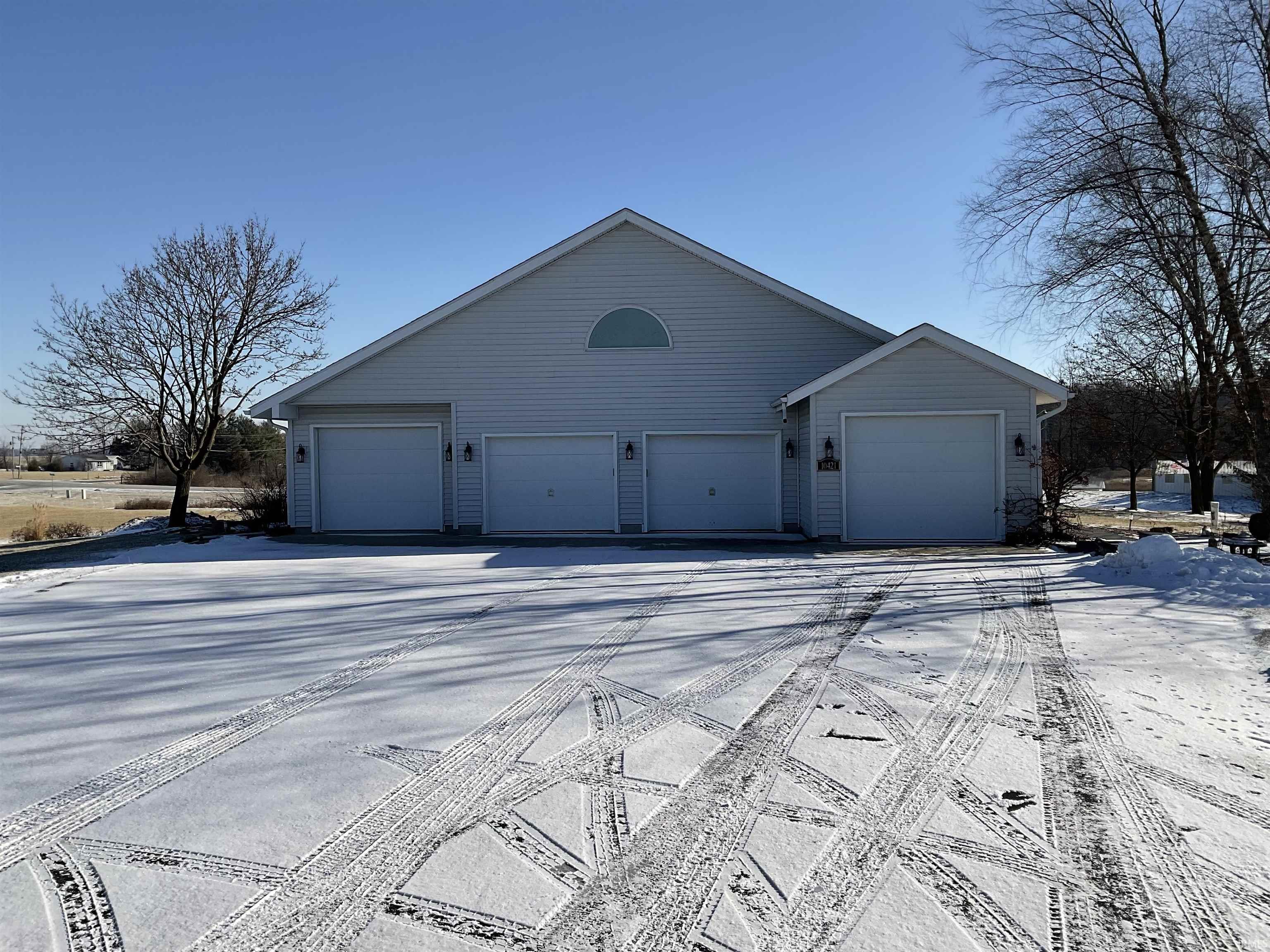View of property exterior featuring a garage