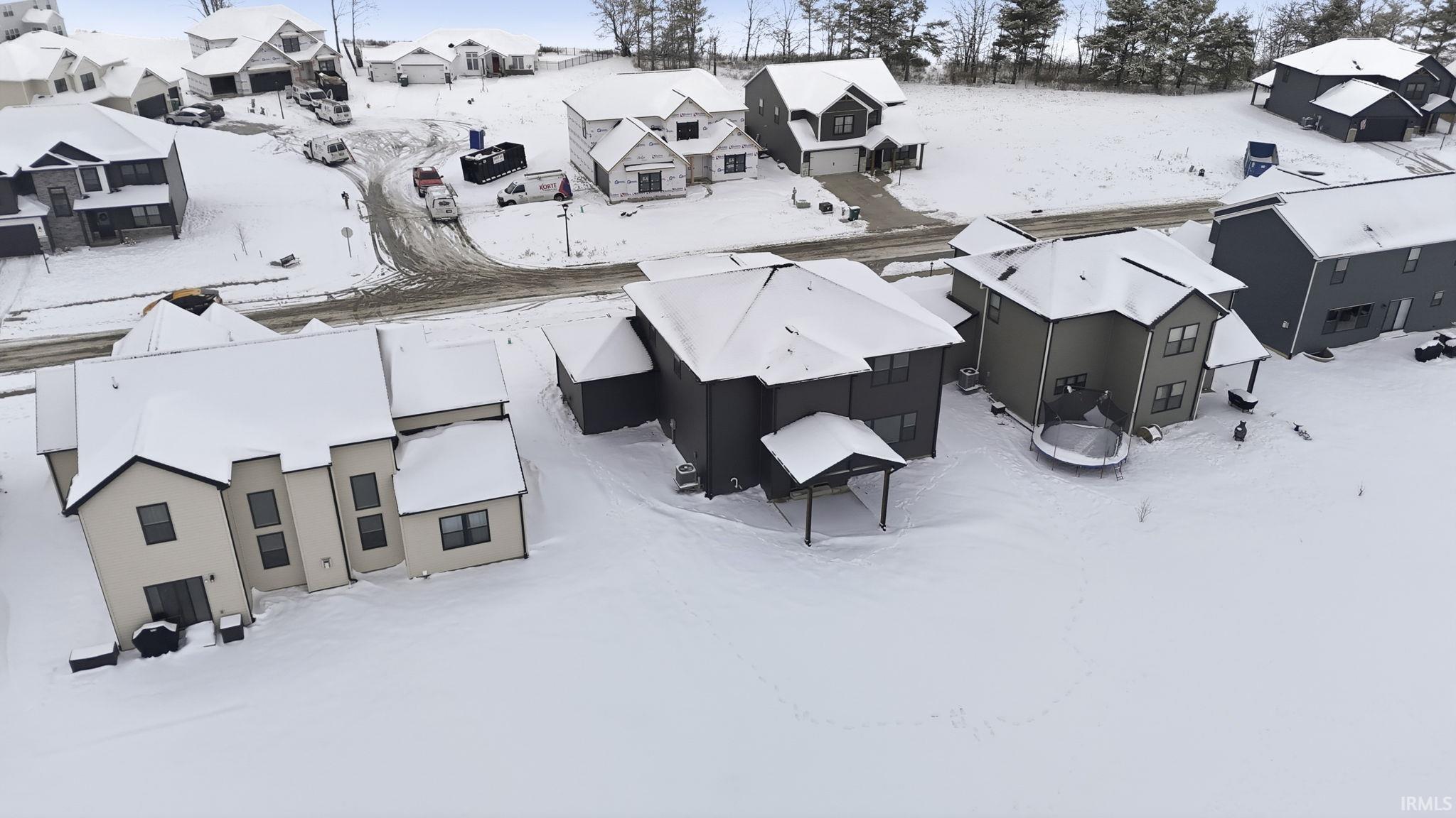 Snowy aerial view with a residential view