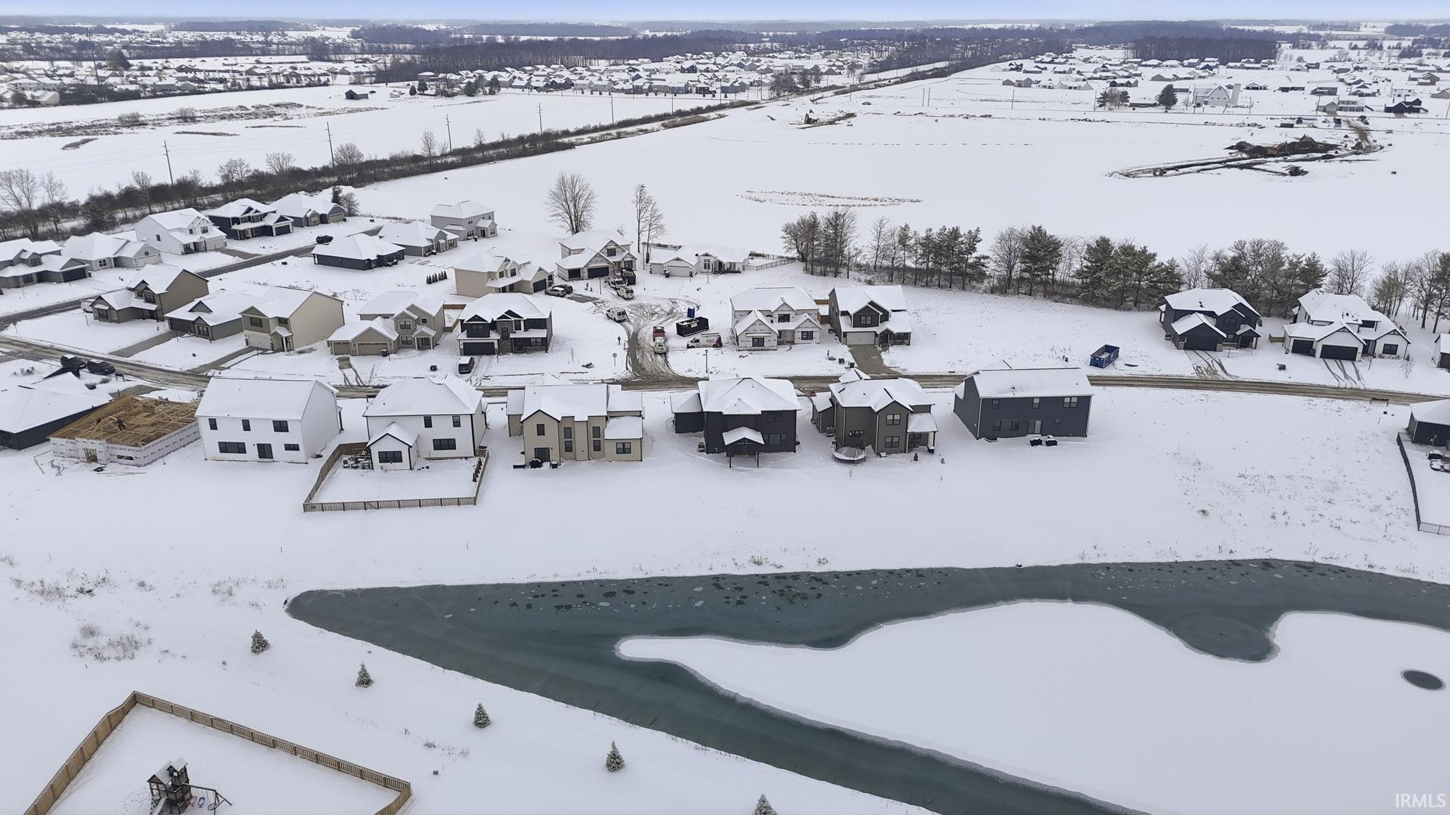 Snowy aerial view with a residential view