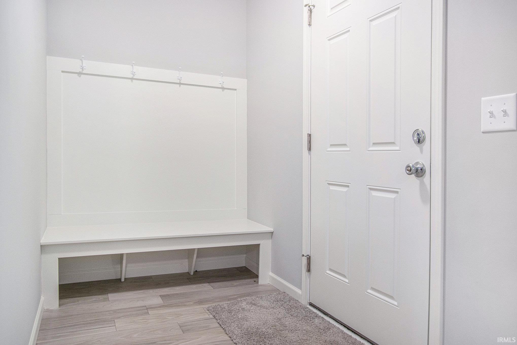 This traditional 2 story floorplan is laid out with 4 bedrooms on the second floor and several upgraded finishes.  The flooring is consistent throughout the entire first floor and there is a built-in bench for storage in the foyer.