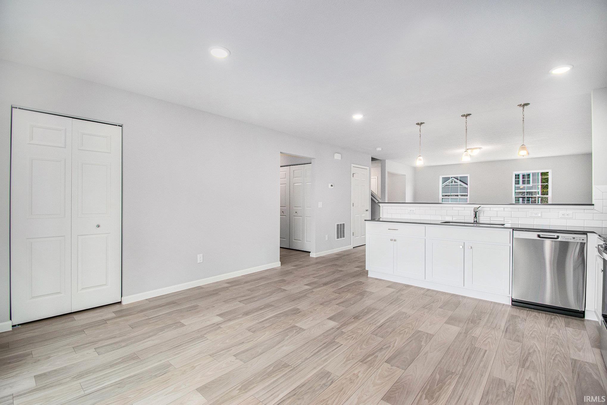 The dining nook can accommodate a large table and has direct access to the rear yard.