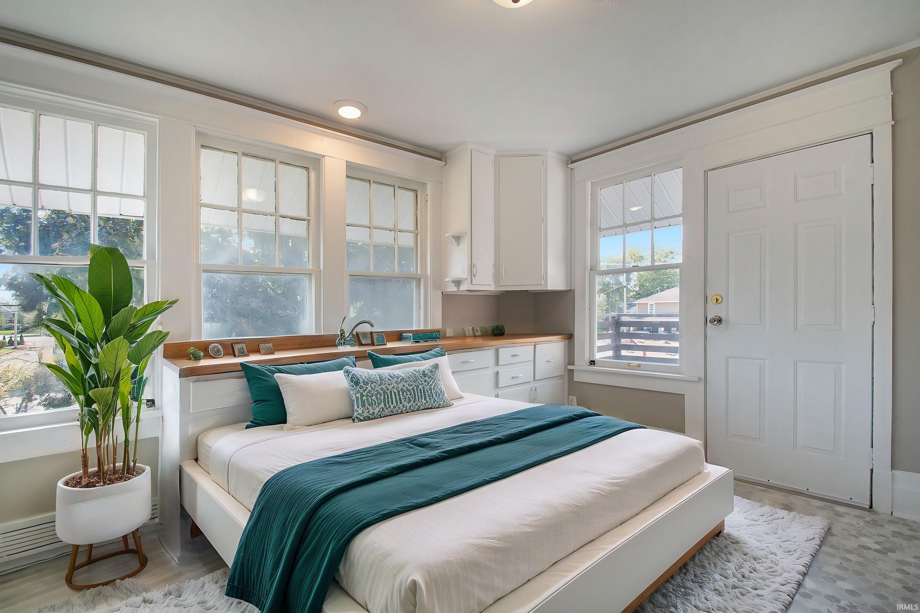 This could be a very art cool studio with all the windows/natural light and attached deck