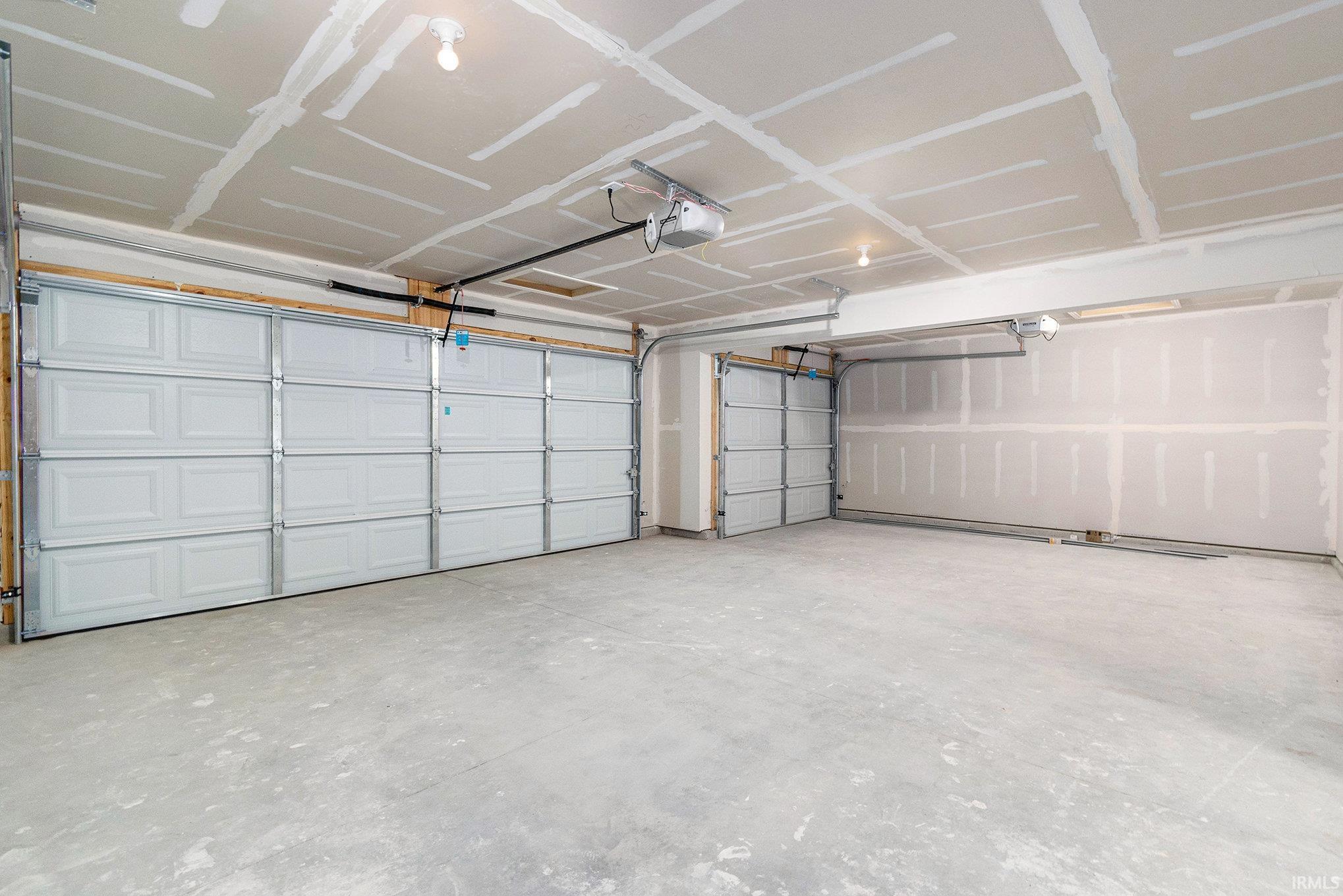 2 stall attached garage with 10x18 3rd Stall