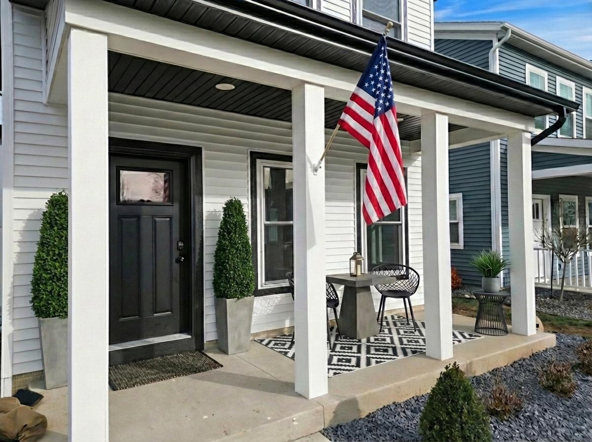 Property entrance with covered porch