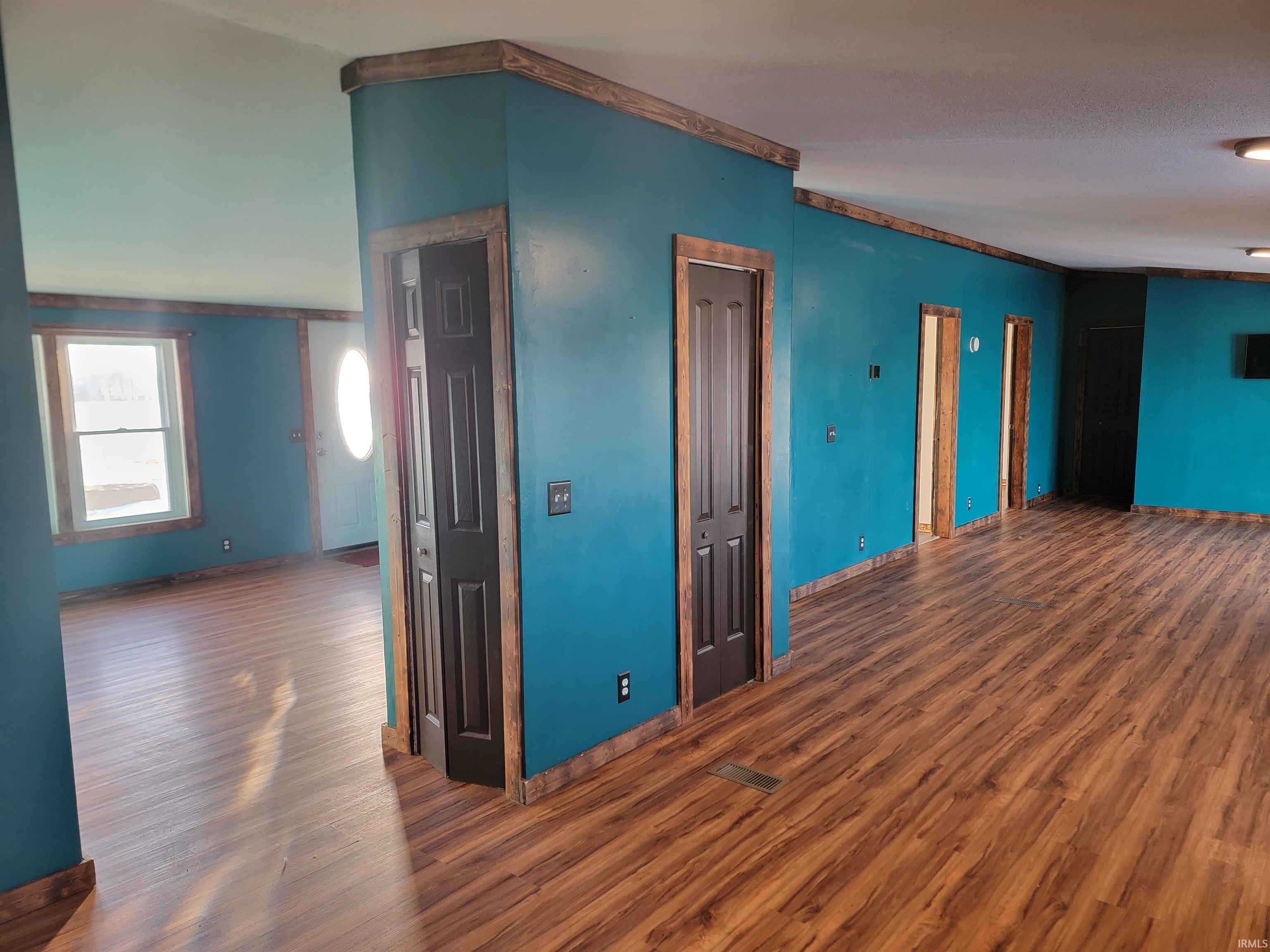 Spare room featuring wood finished floors