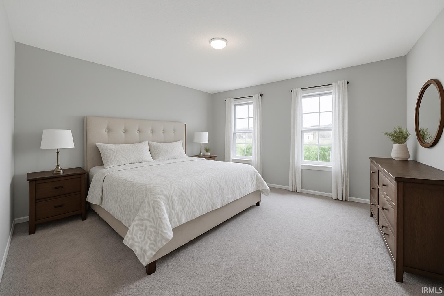 Carpeted bedroom featuring baseboards
