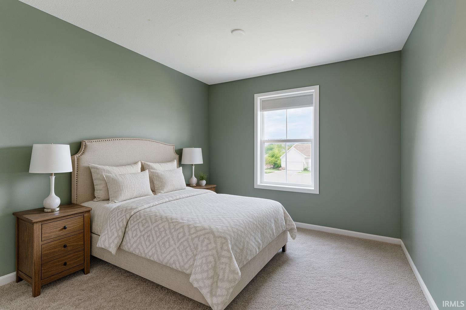 Bedroom featuring carpet flooring and baseboards