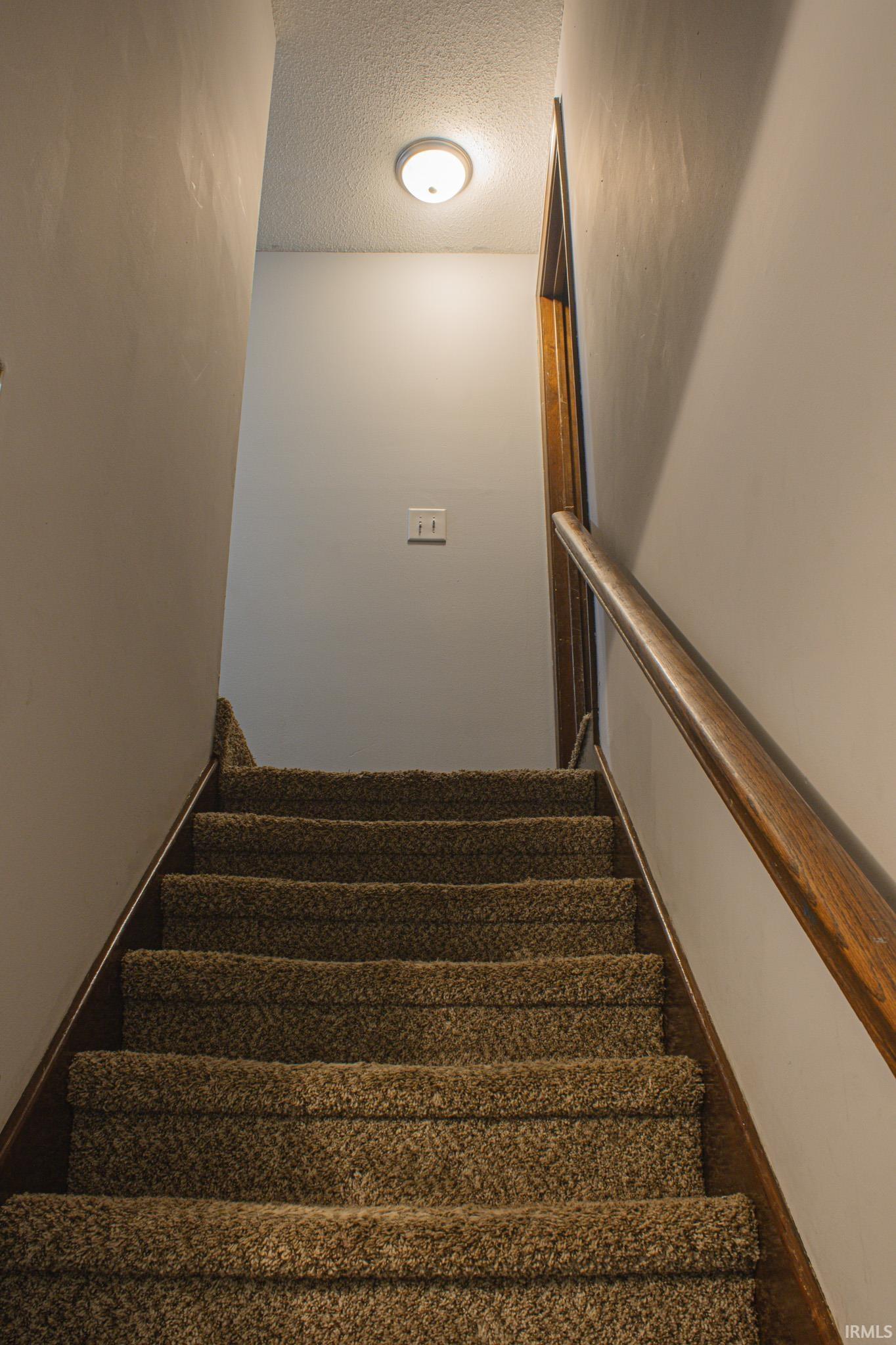 Stairway with a textured ceiling