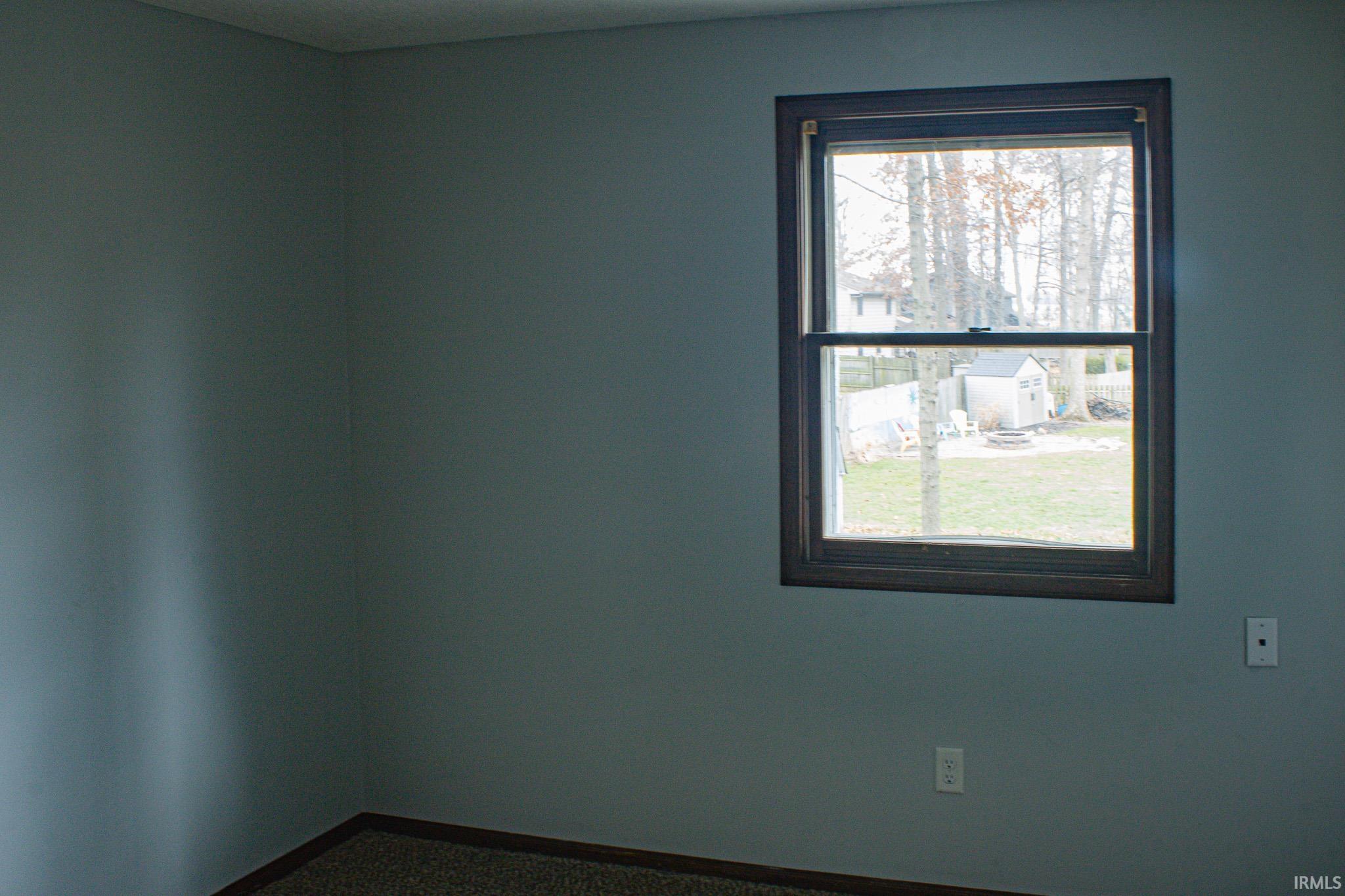 Unfurnished room featuring baseboards