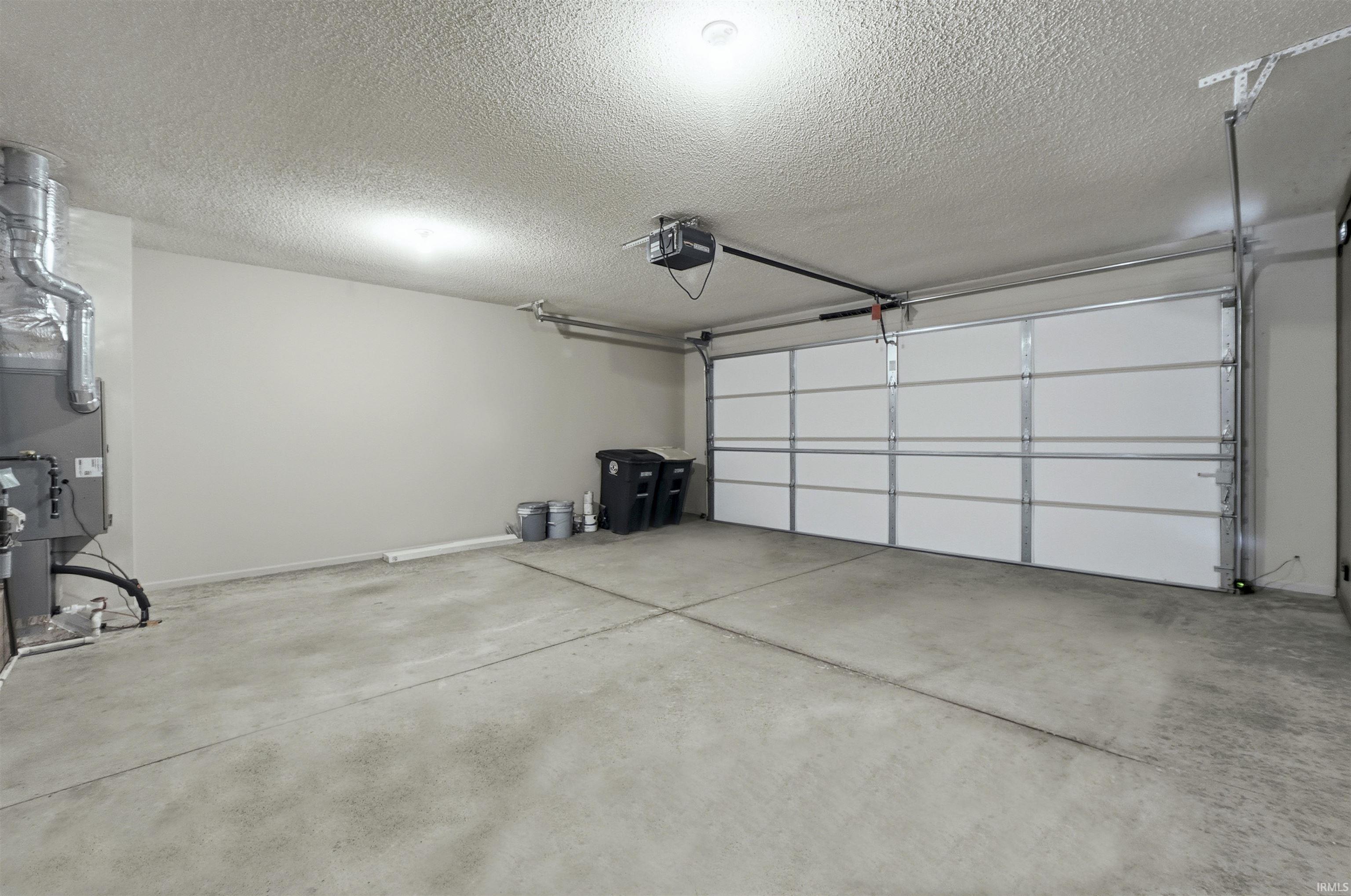Garage with heating unit and a garage door opener