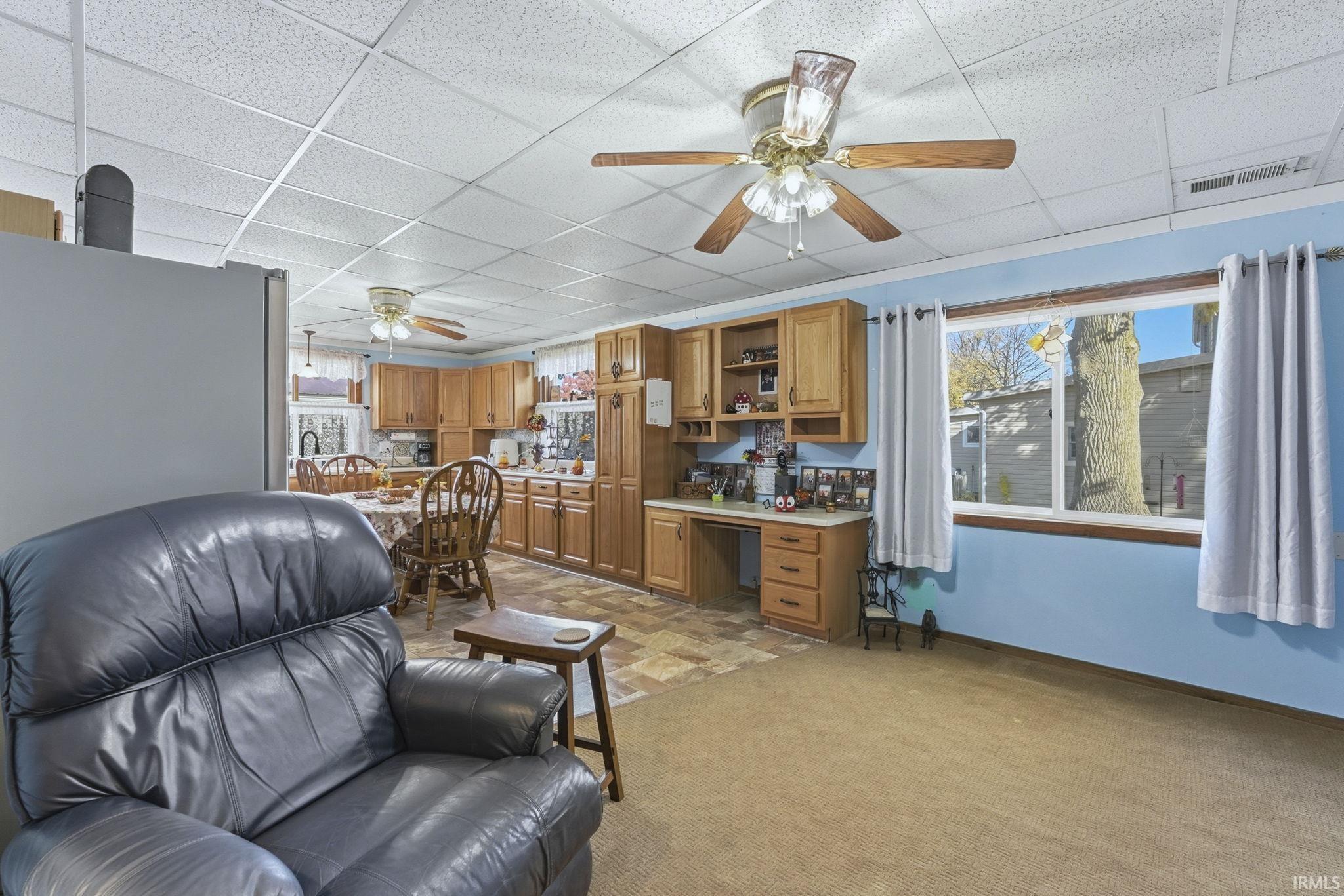 Notice the built-in Desk and extra cabinets in the background.