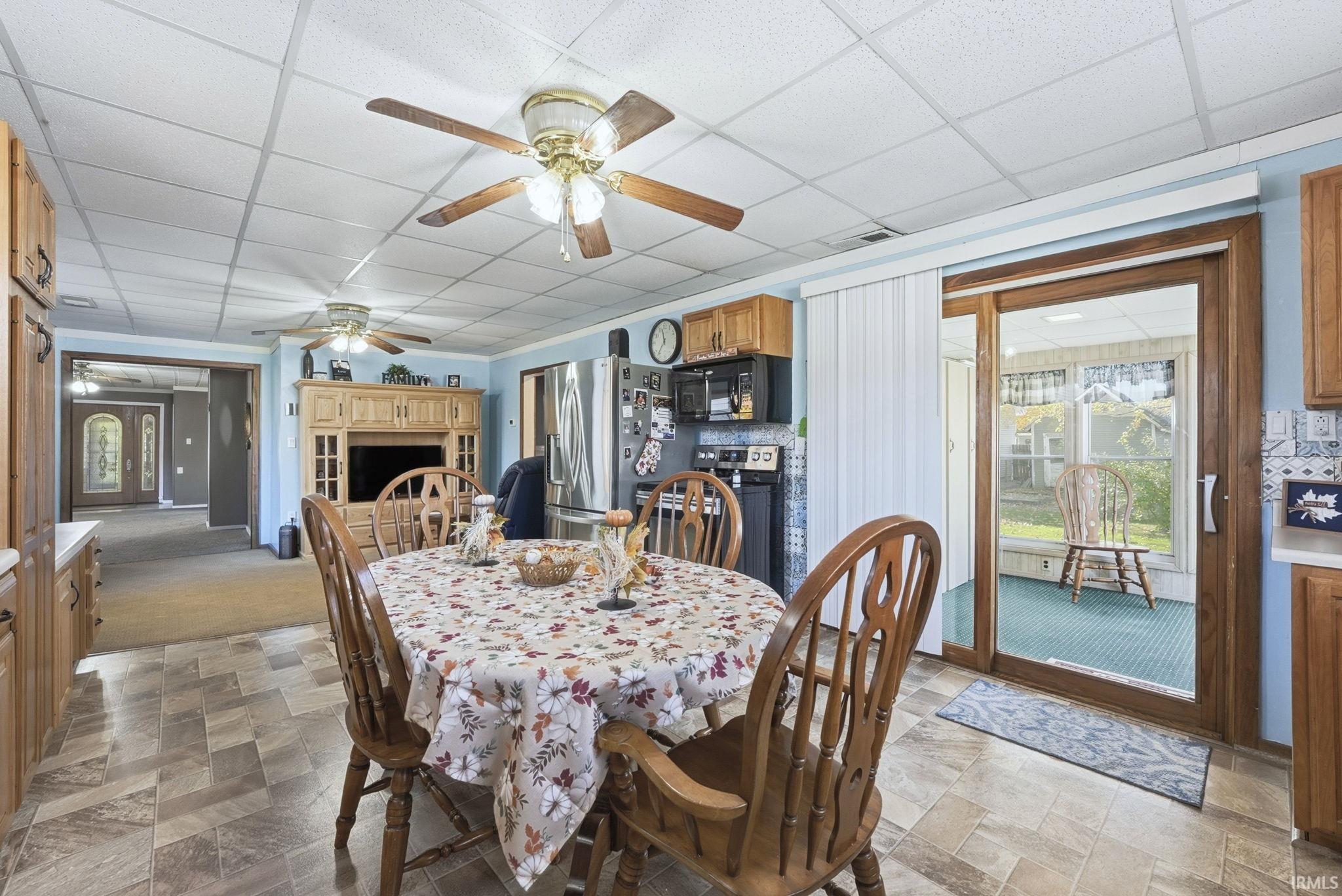 The sliding glass door leads to an extra sunroom. This room leads to a lovely open deck off the back of the house.