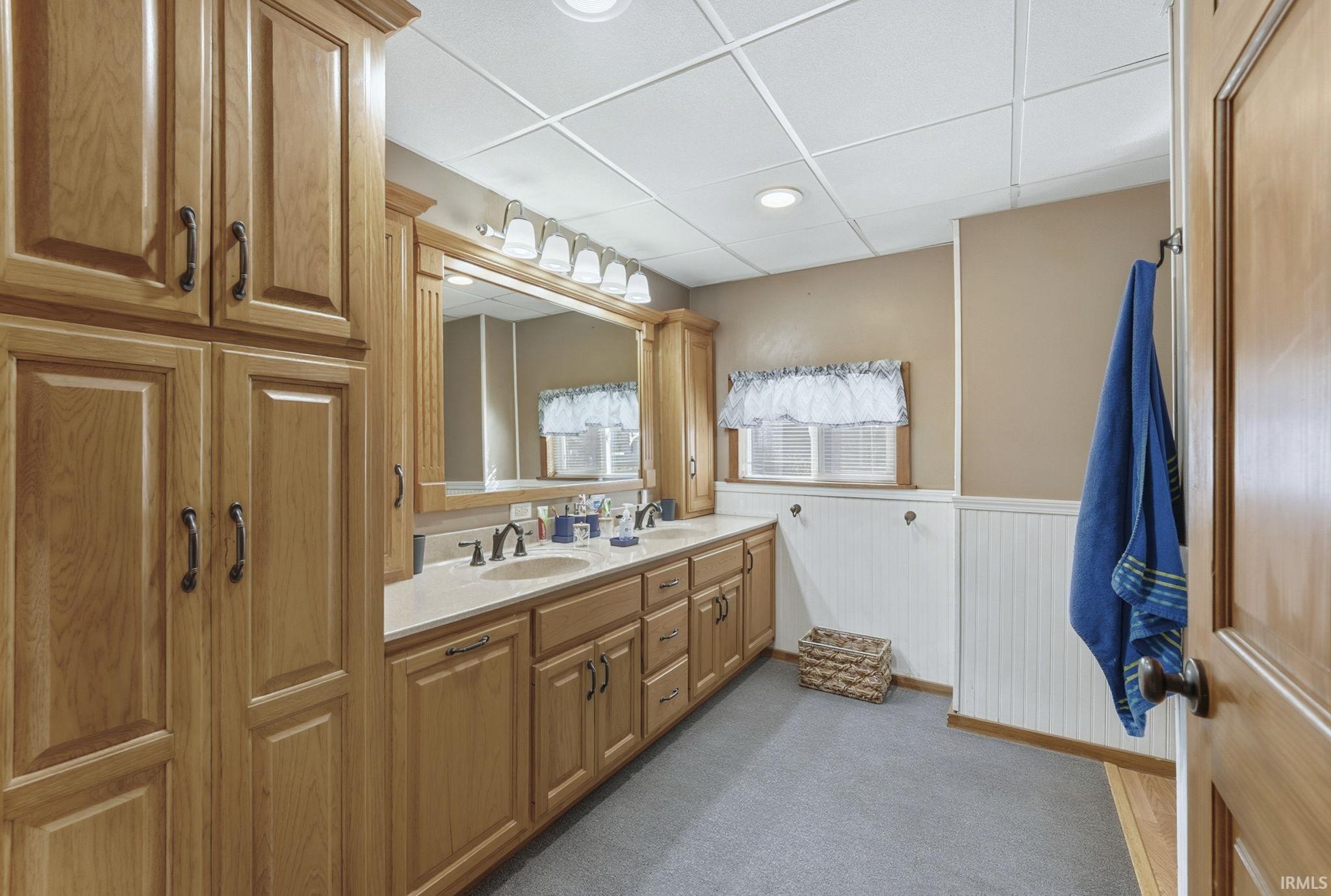 Double sink and linen closet.