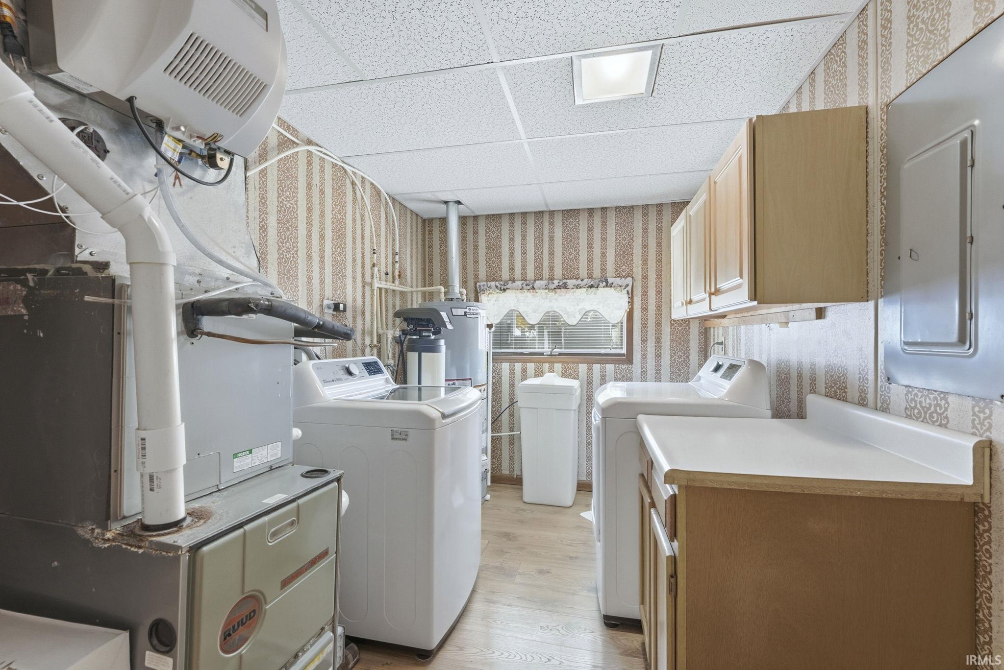 Washer and Dryer Stay. Has a folding area with cabinets below and above.