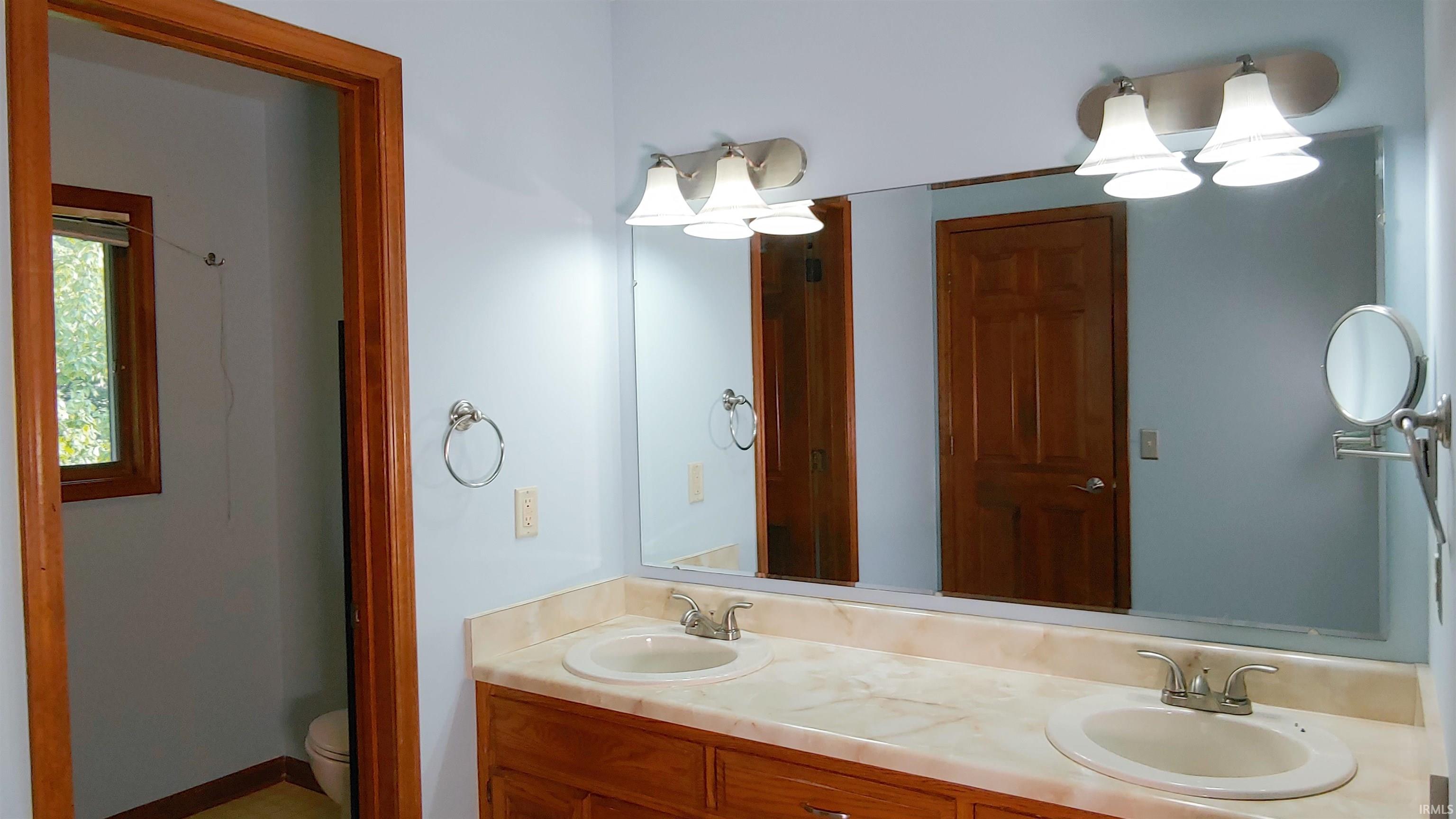 Bathroom featuring double vanity