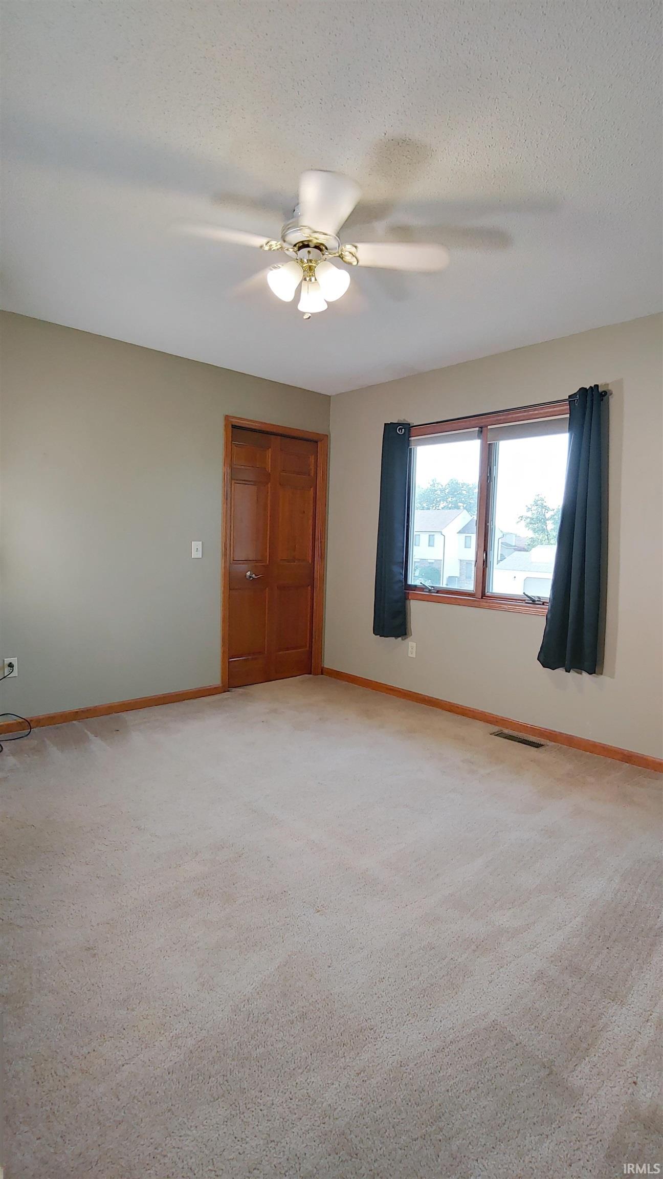 Bedroom 2 featuring carpet and ceiling fan