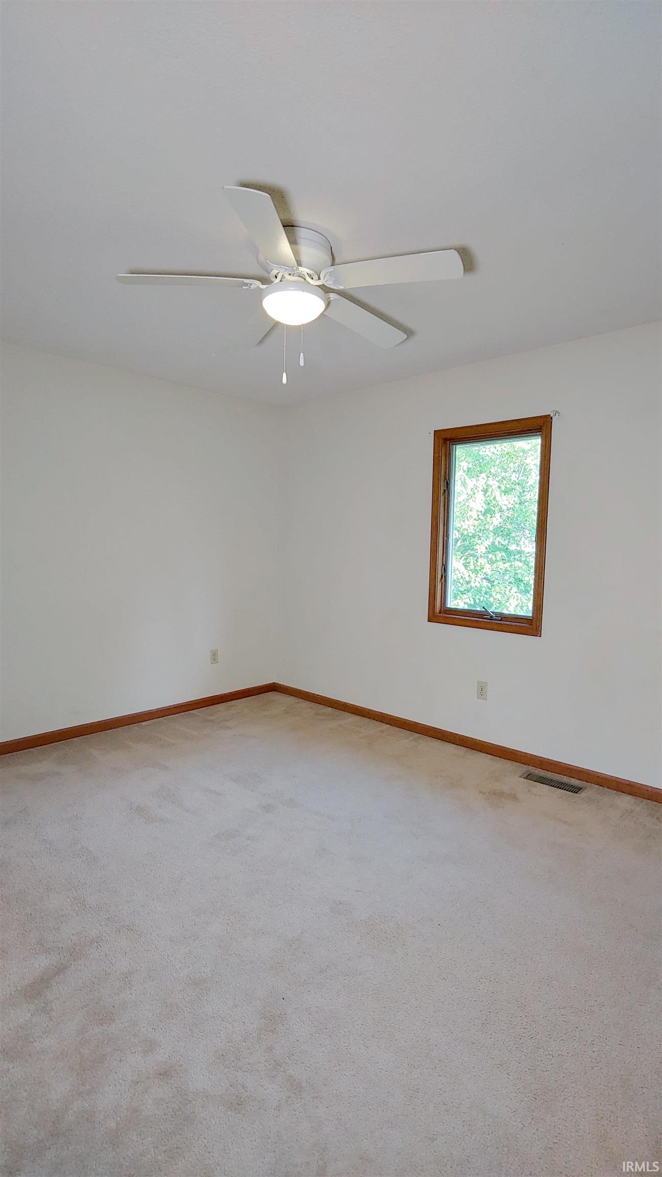 Bedroom 1 featuring carpet and ceiling fan