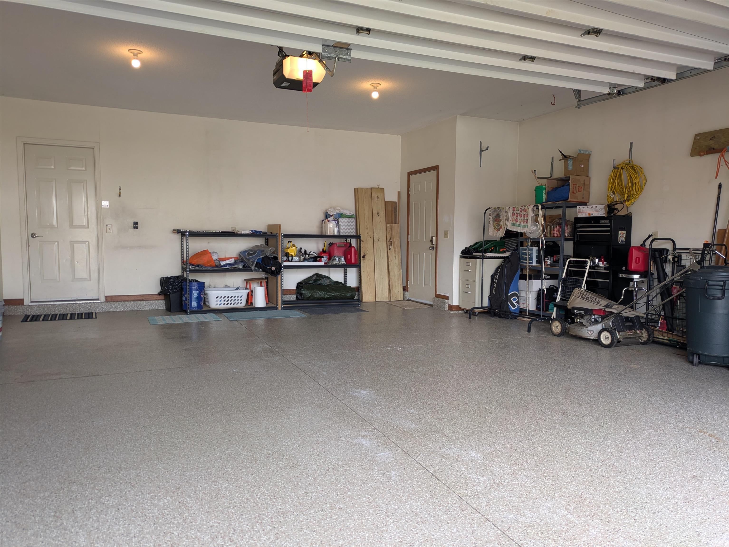 Garage with extension storage area and epoxy floor