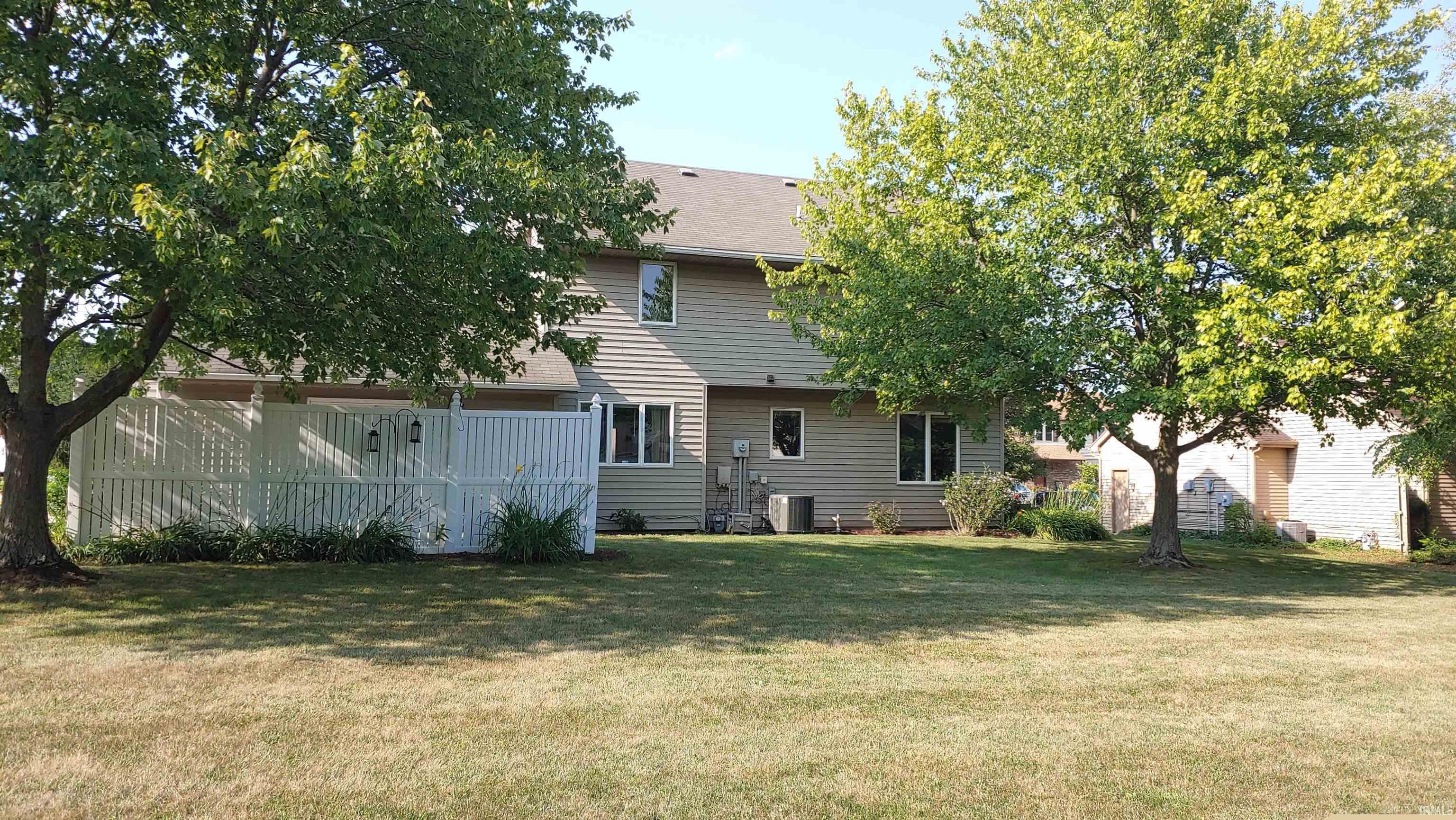 Rear view of house and yard