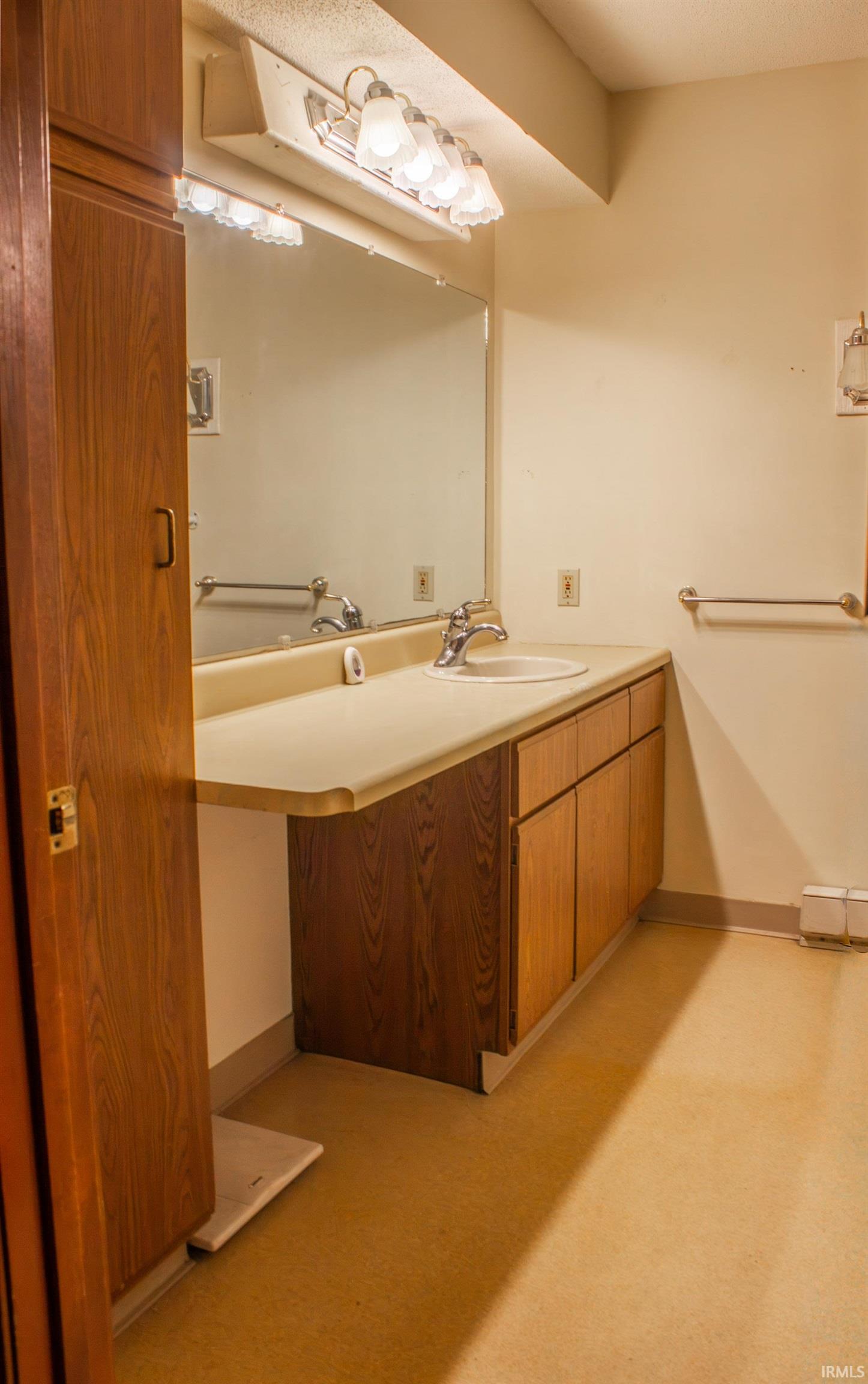 Bathroom with baseboards and vanity