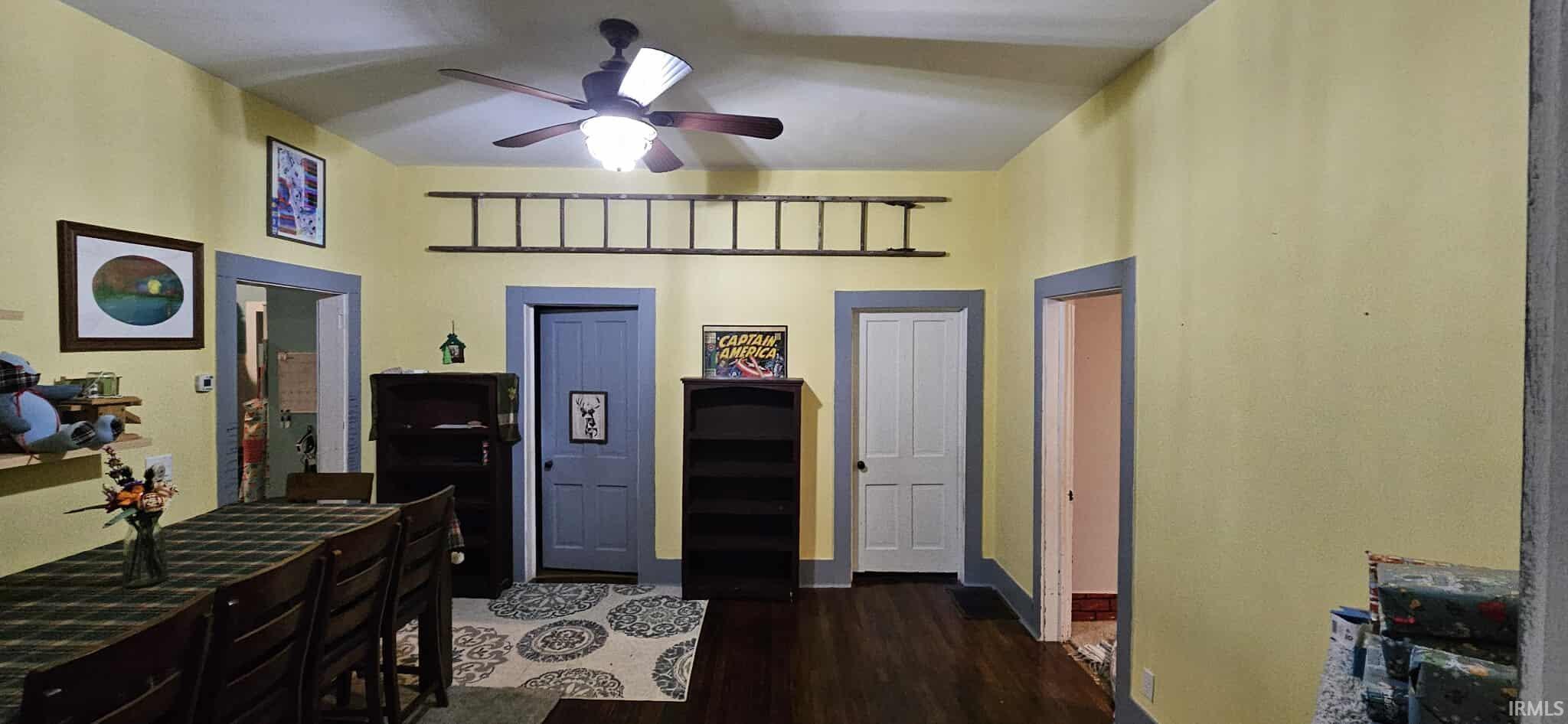 Bedroom featuring dark wood-style flooring and a ceiling fan