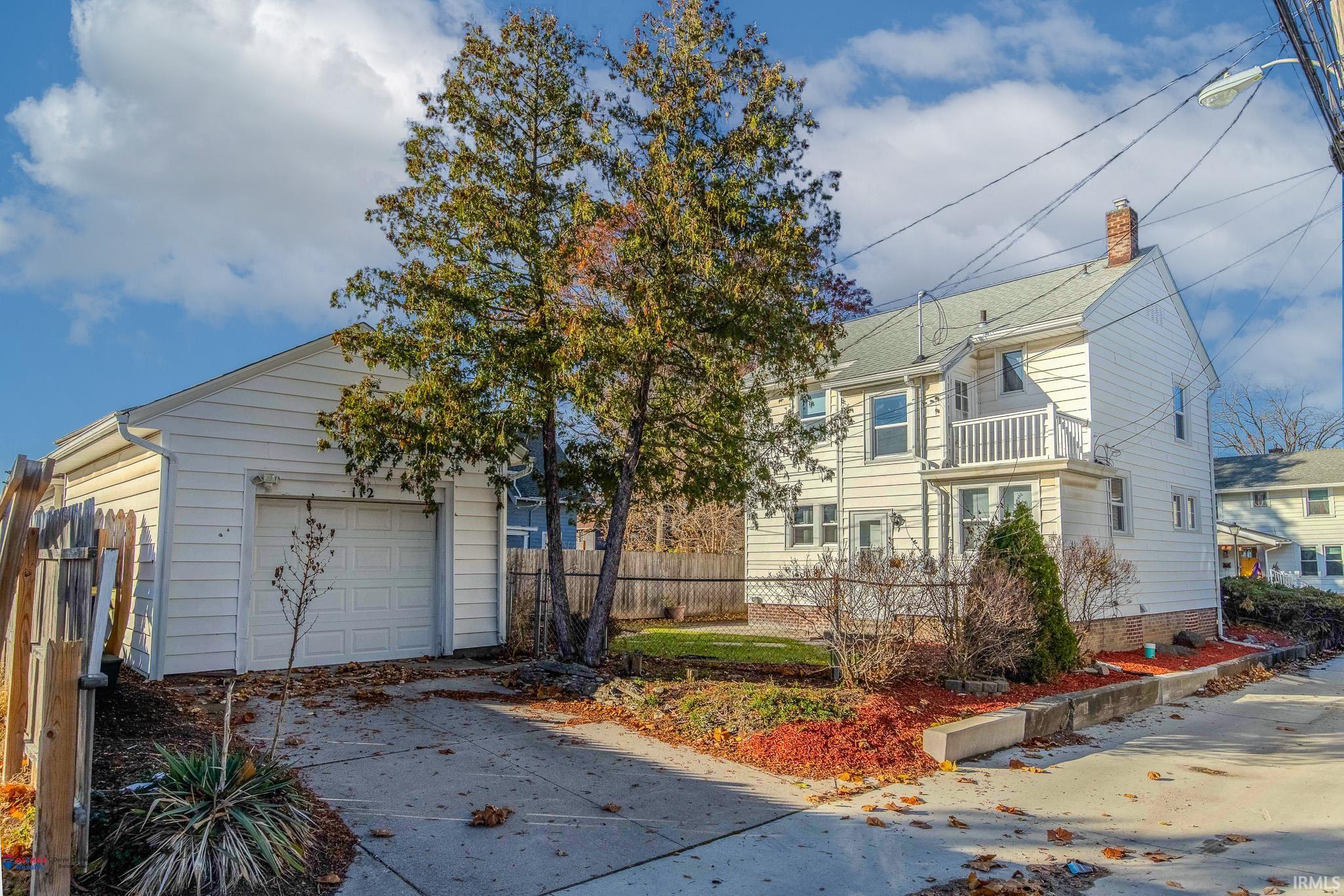 1 Car detached garage next to fenced in backyard.