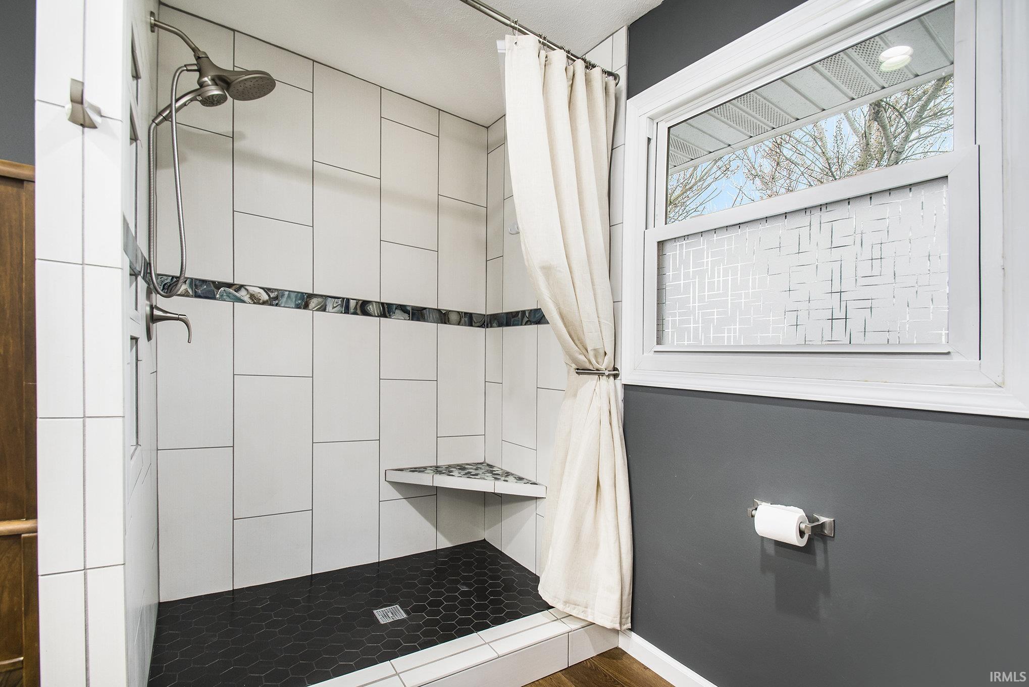 Bathroom with walk-in tiled shower