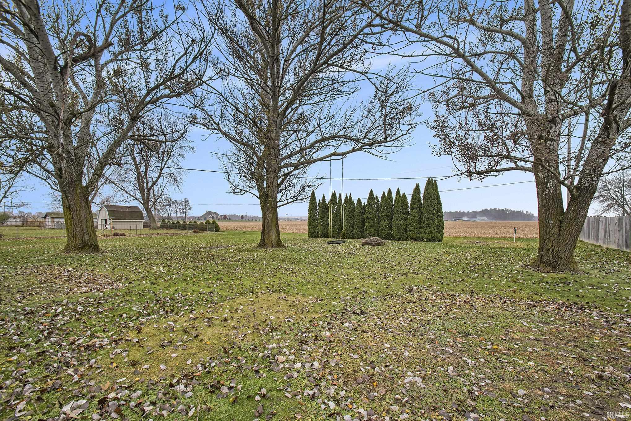 View of yard with a rural view