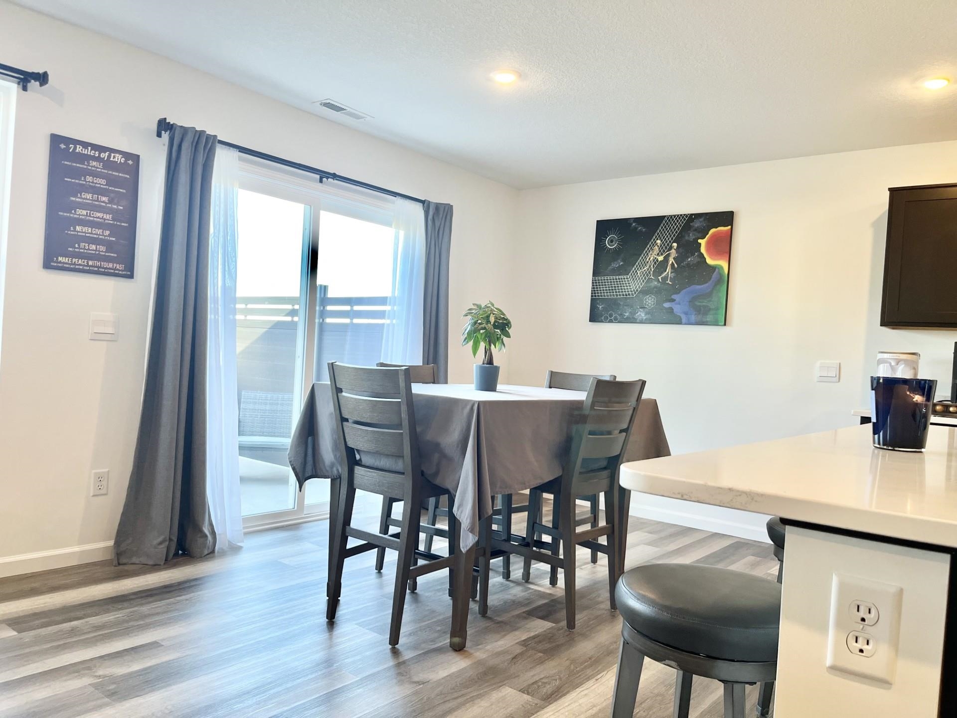 Dining room featuring light wood-style flooring and recessed lighting