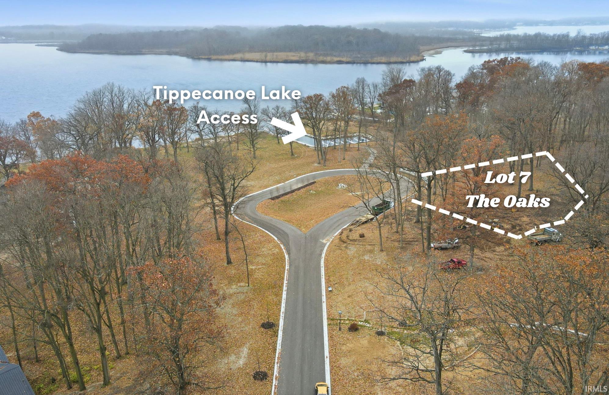 Aerial view of property's location featuring a large body of water