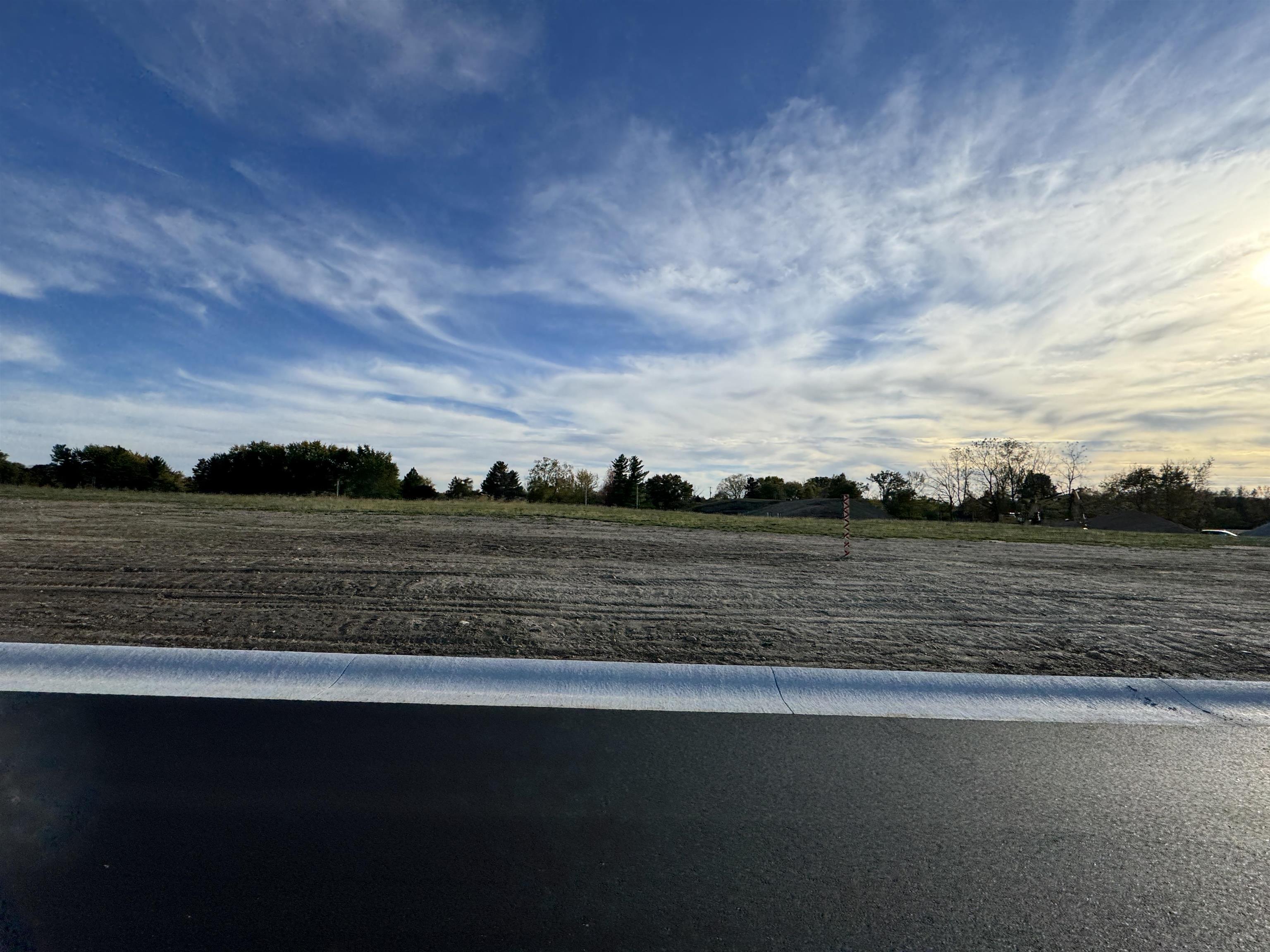 View of yard with a rural view