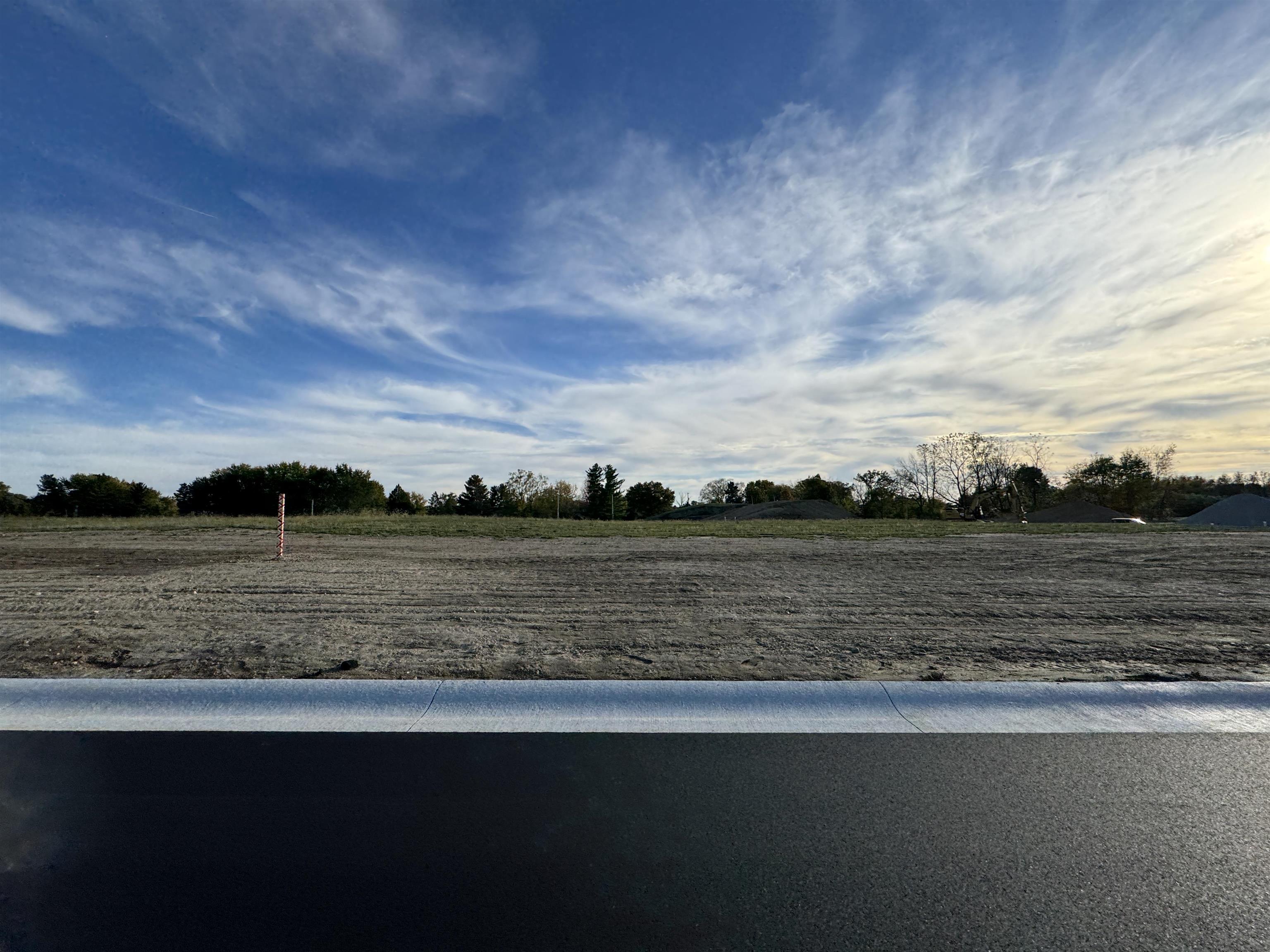 View of yard with a rural view