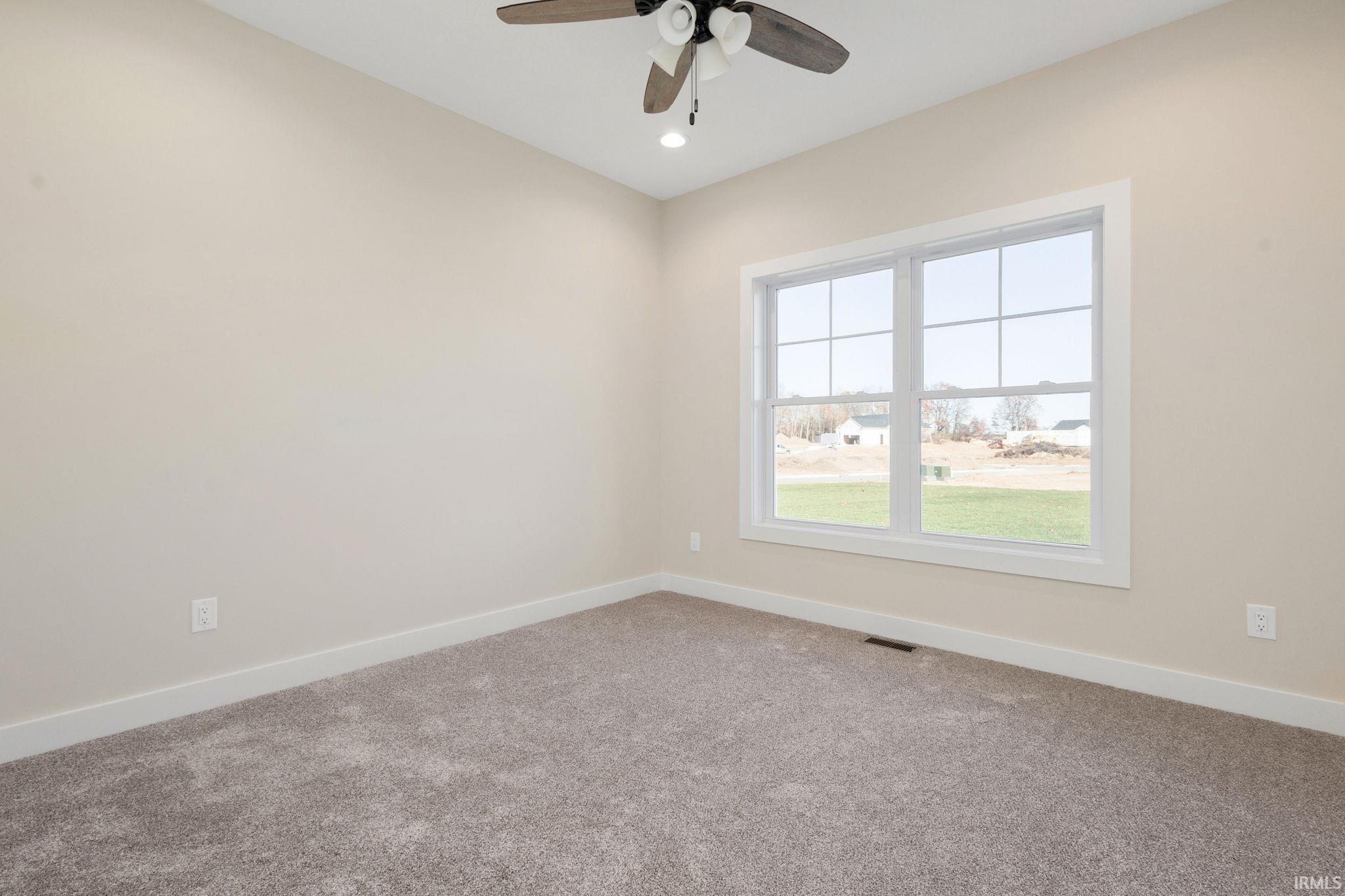 Spare room featuring carpet flooring, recessed lighting, and a ceiling fan