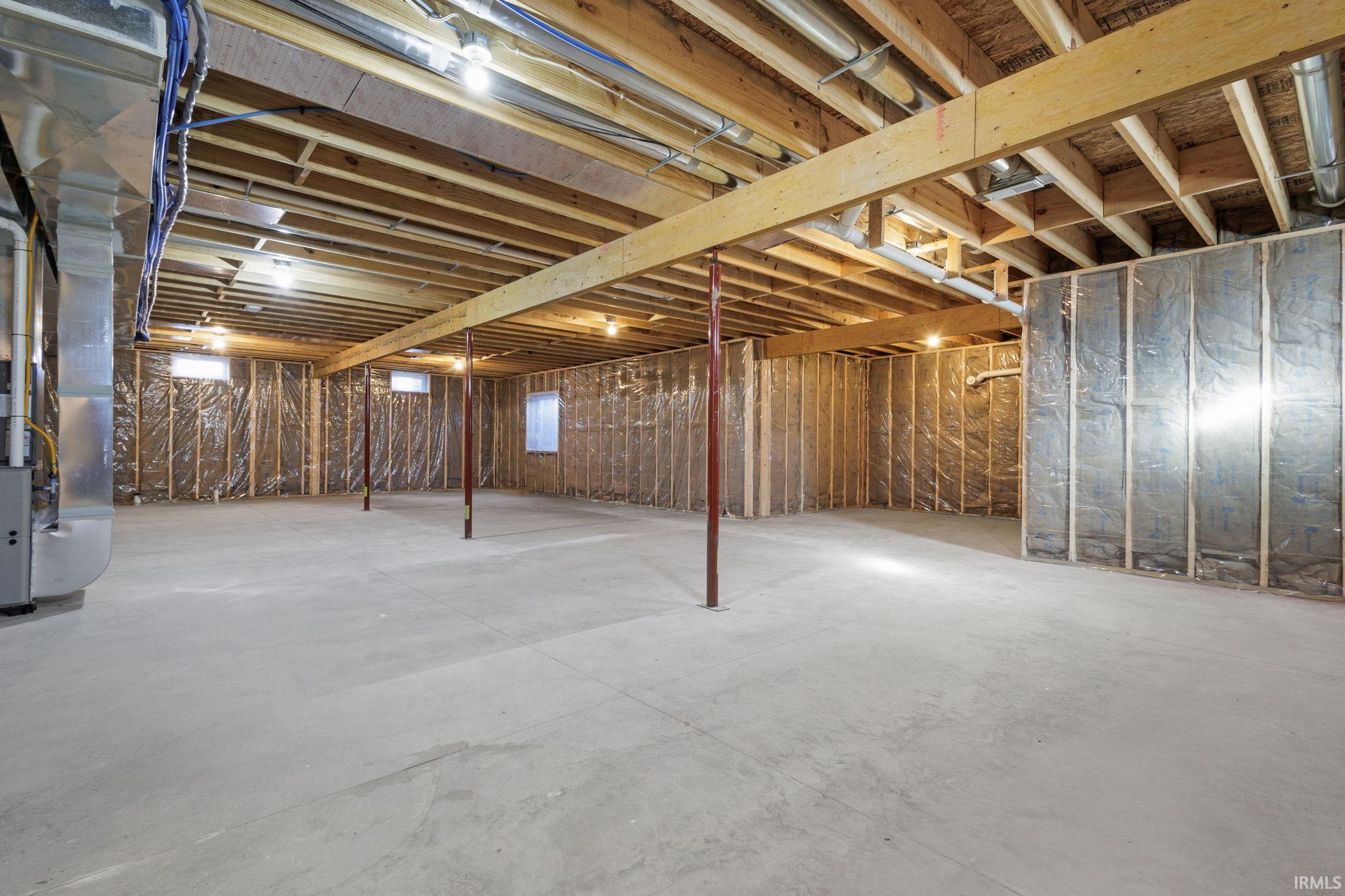 Unfinished basement with heating unit