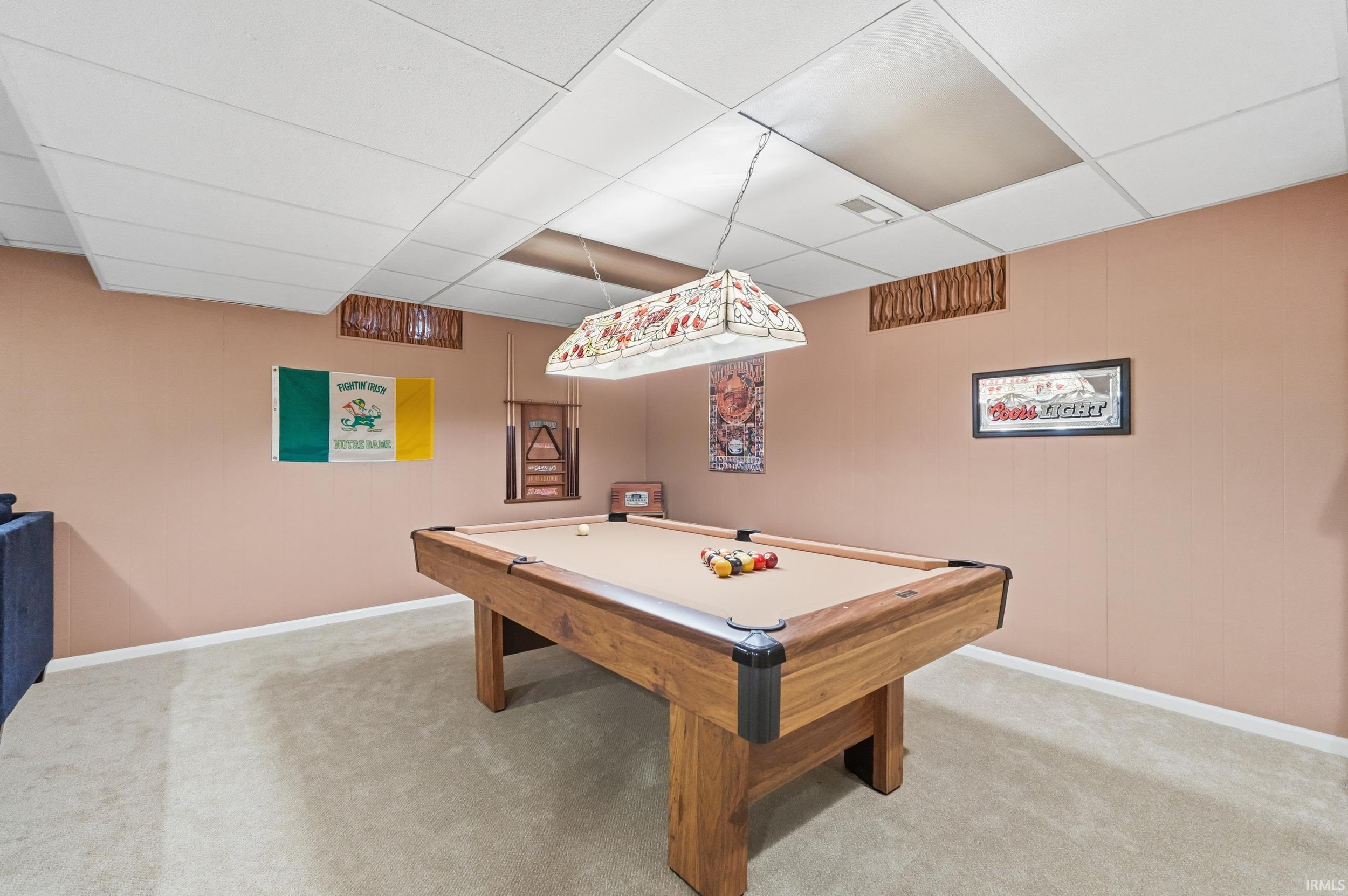 Game room with a paneled ceiling, billiards, and carpet floors