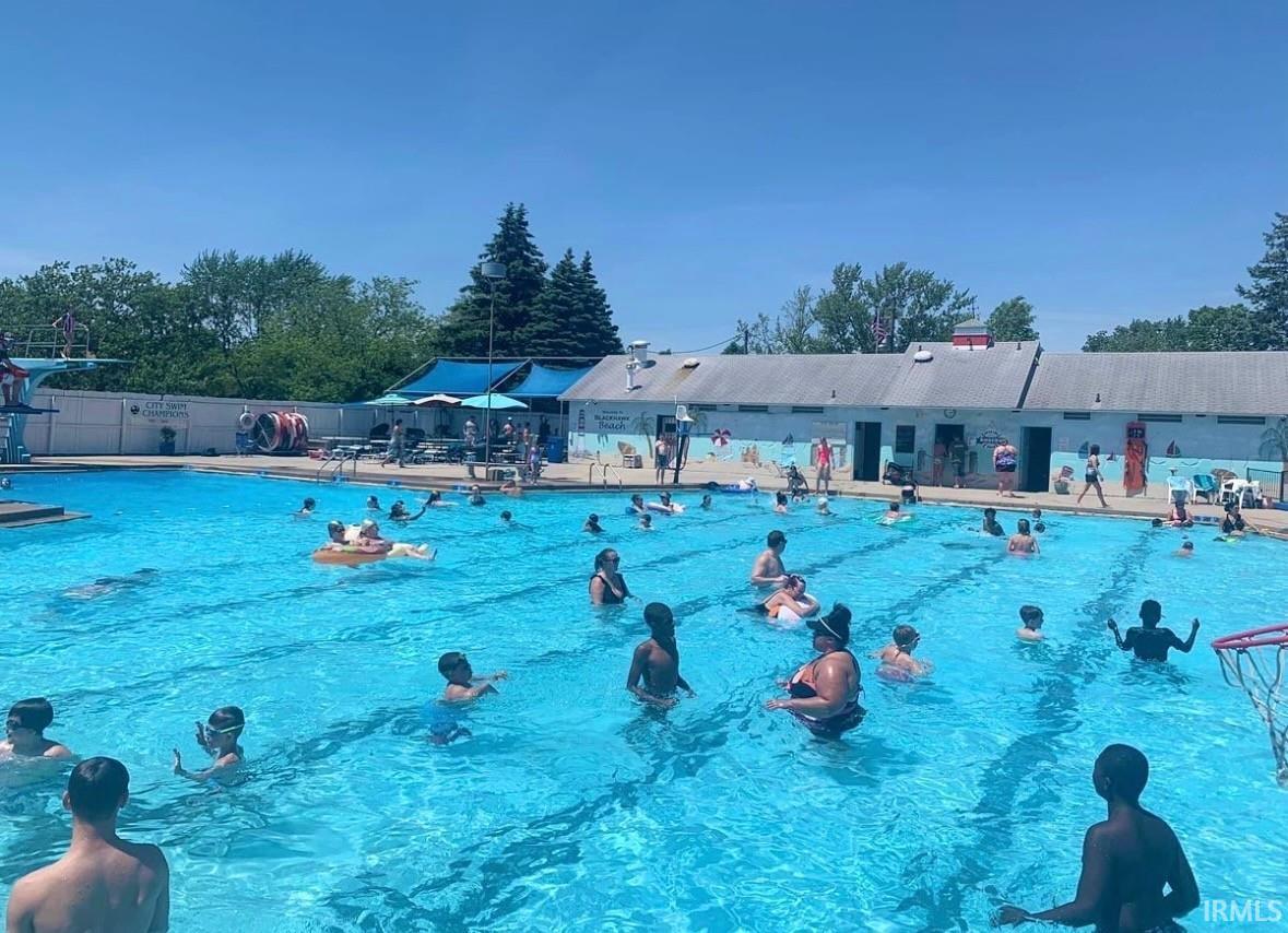 Community pool featuring a patio