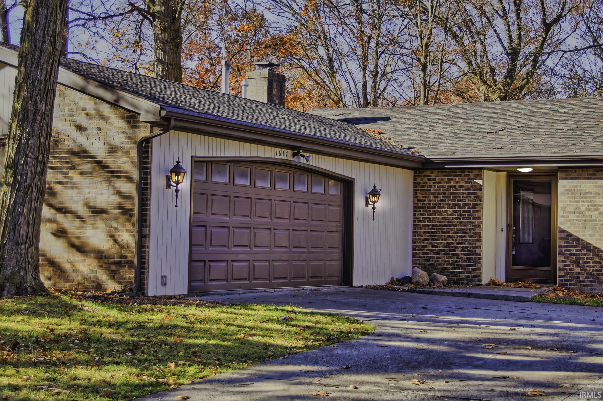 Garage featuring driveway