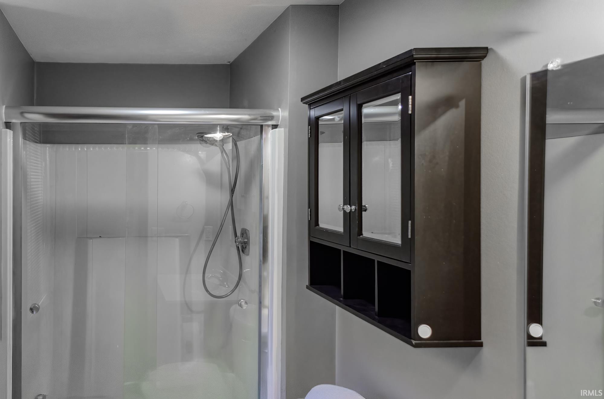 Full bath with a shower stall