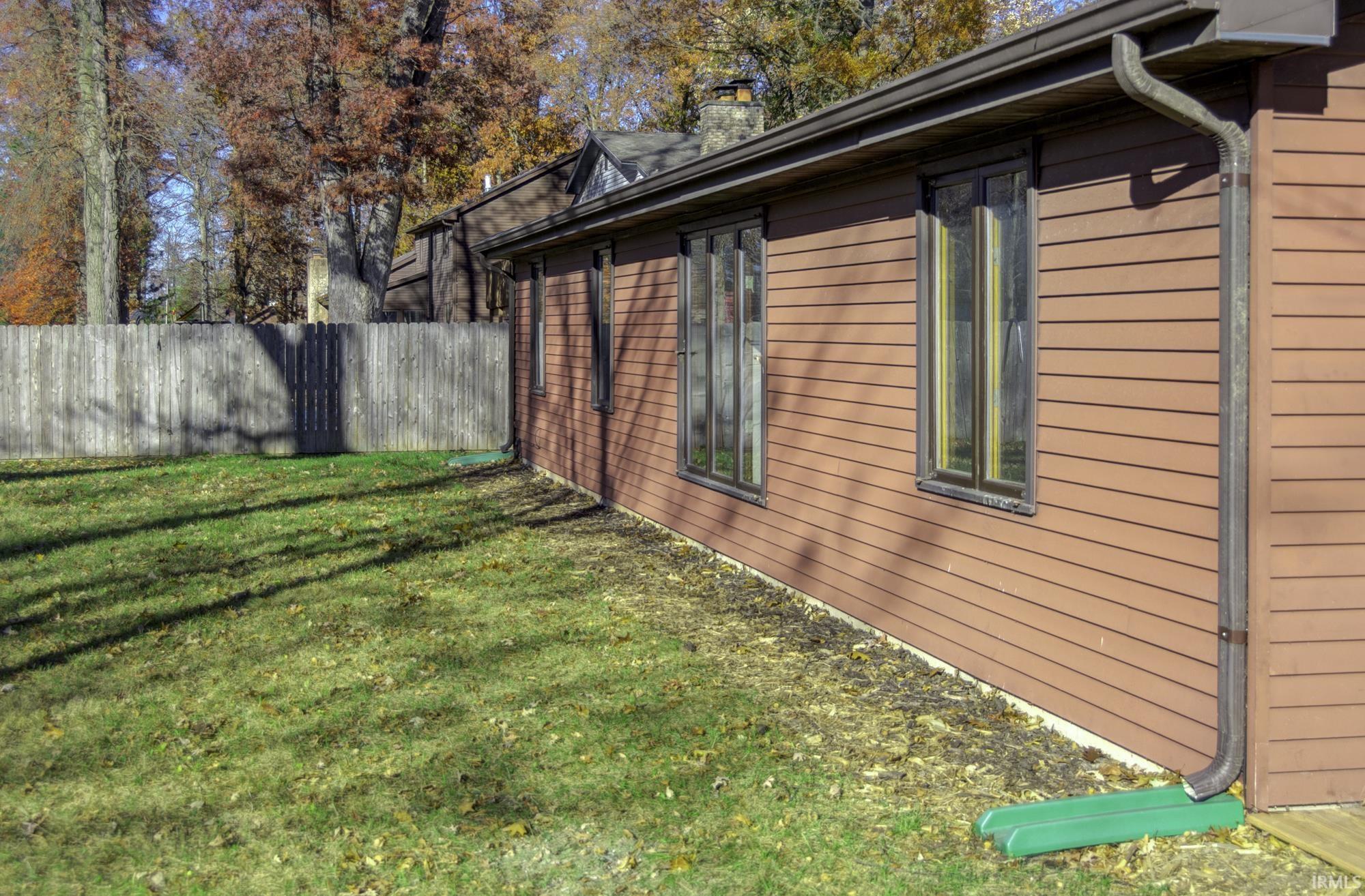 View of side of property featuring a chimney