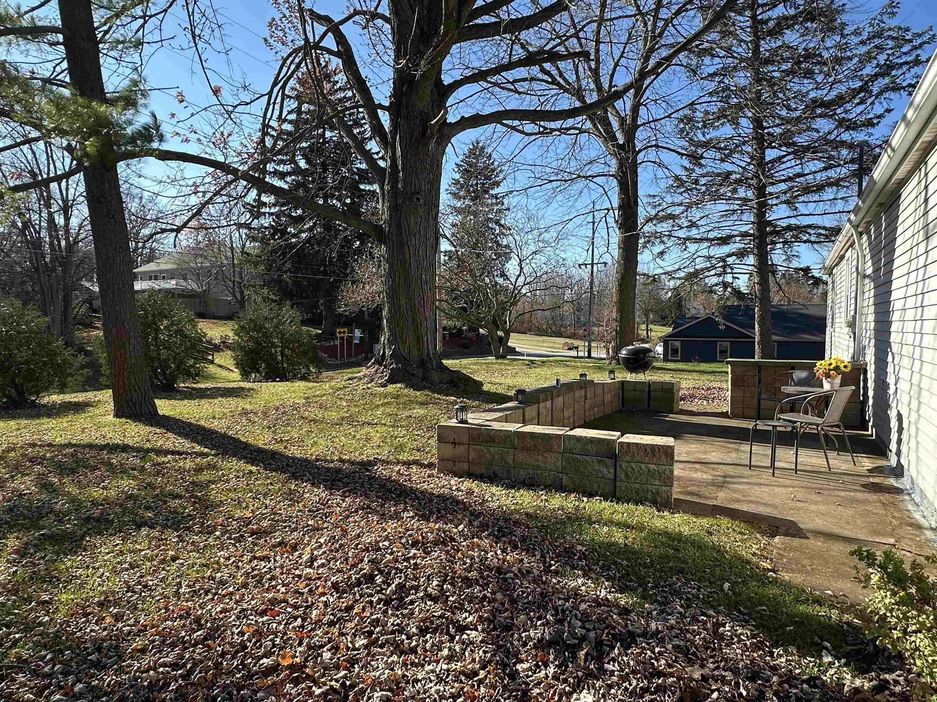 View of grassy yard with a patio