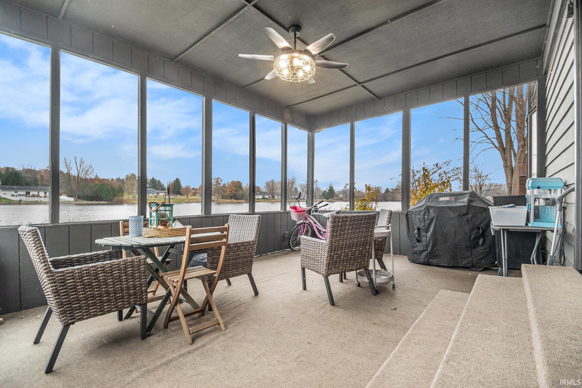 Sunroom with a water view