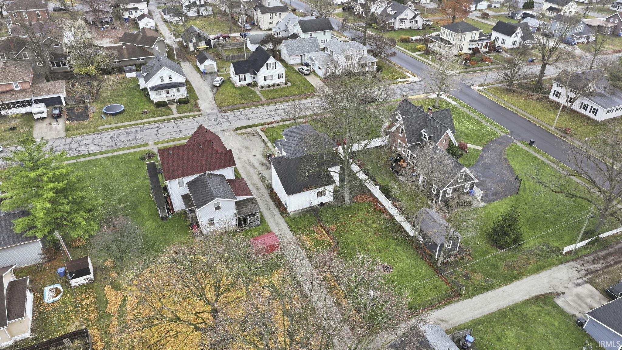 Aerial overview of property's location featuring nearby suburban area