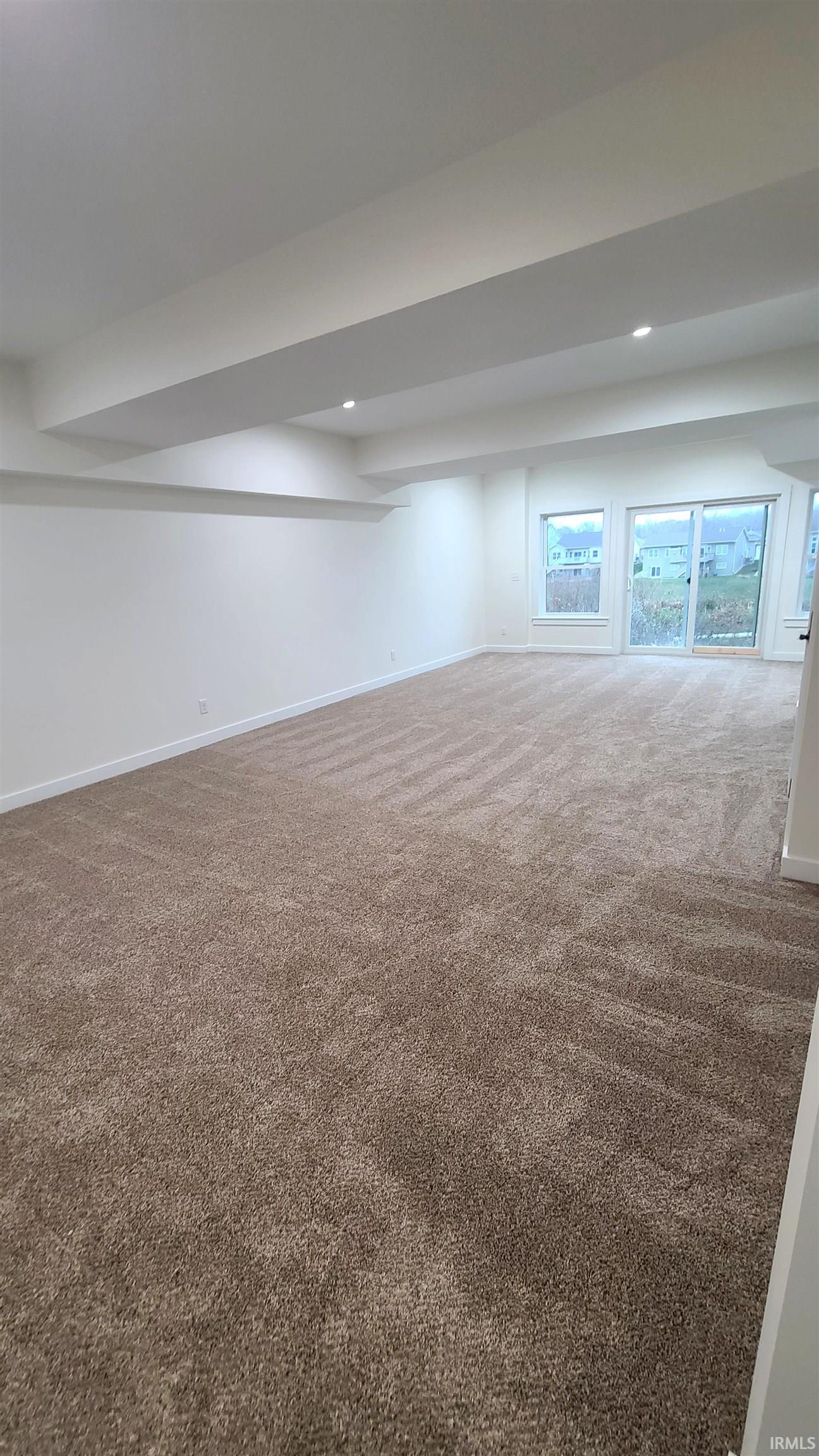 Basement featuring carpet and recessed lighting