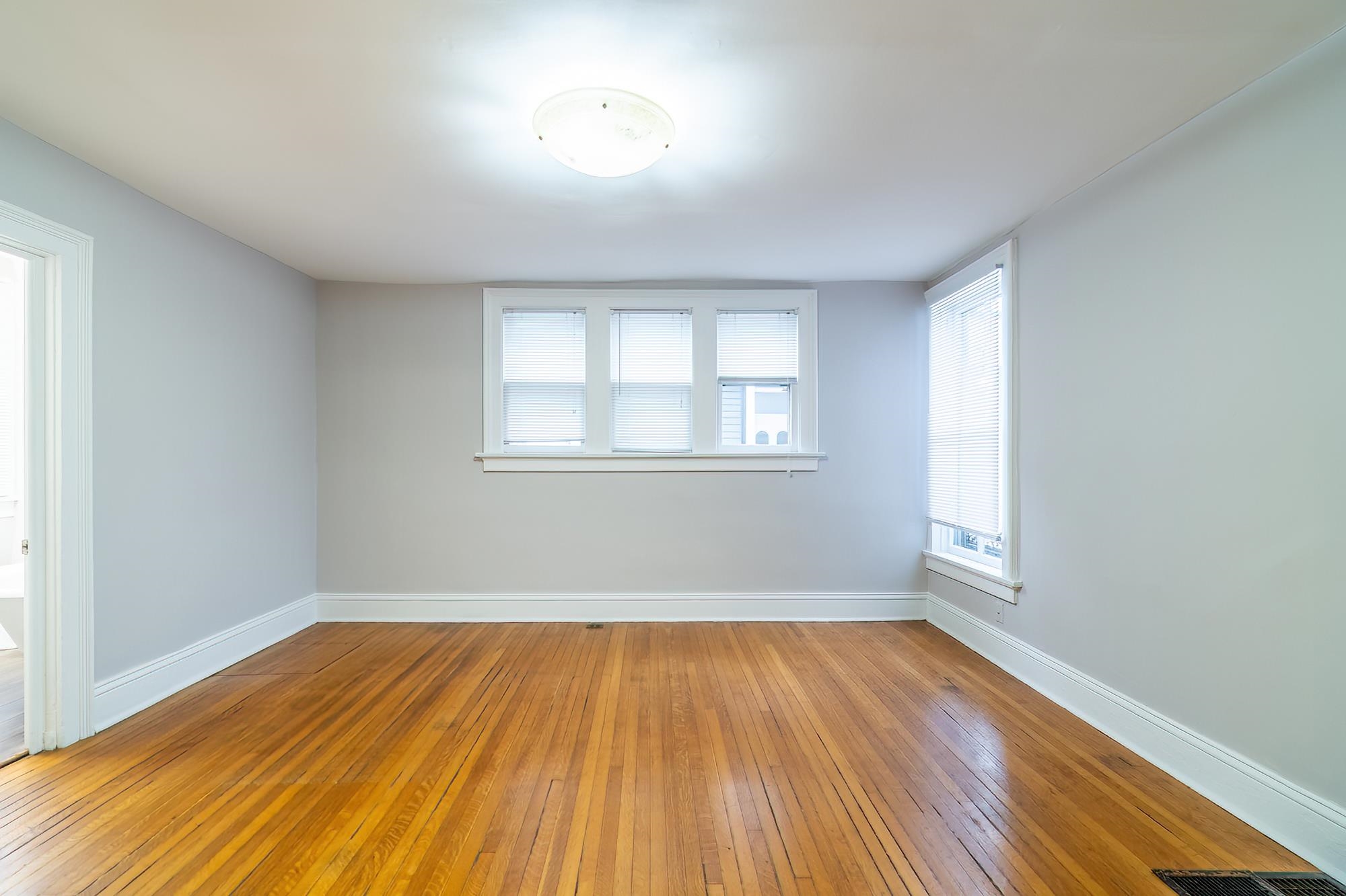 Empty room featuring light wood finished floors and baseboards