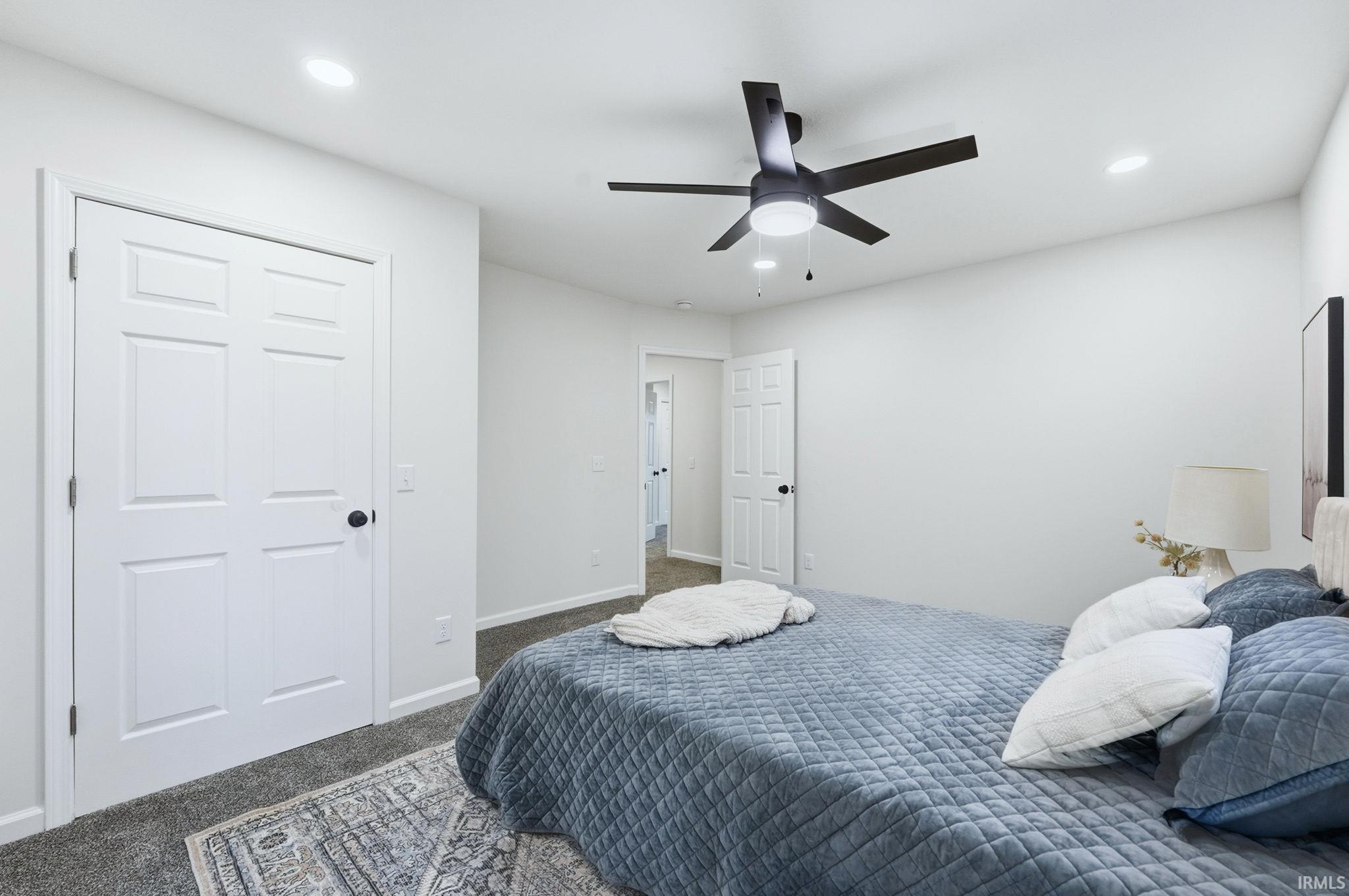 Bedroom featuring carpet floors, recessed lighting, and ceiling fan