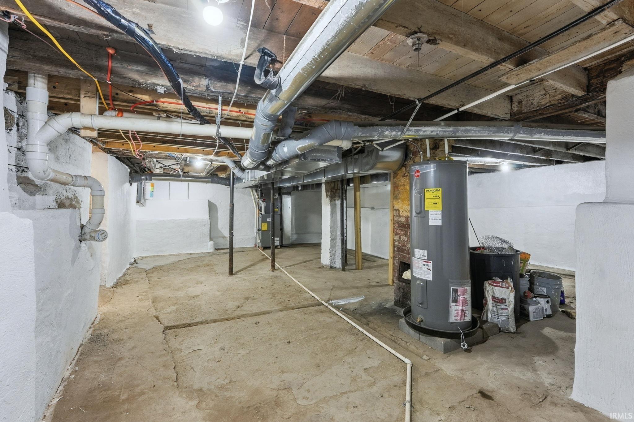 Unfinished below grade area with electric water heater
