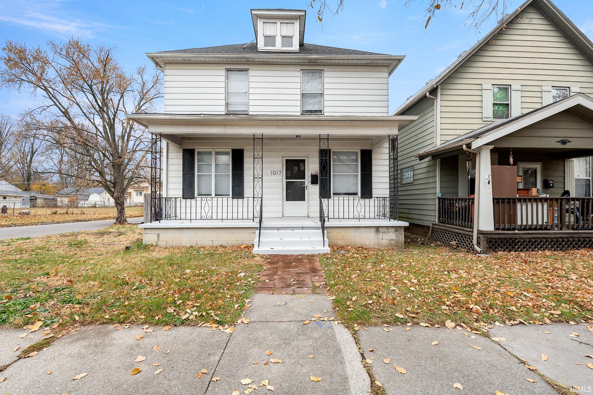 Traditional style home with covered porch