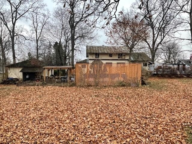 View of yard with a carport